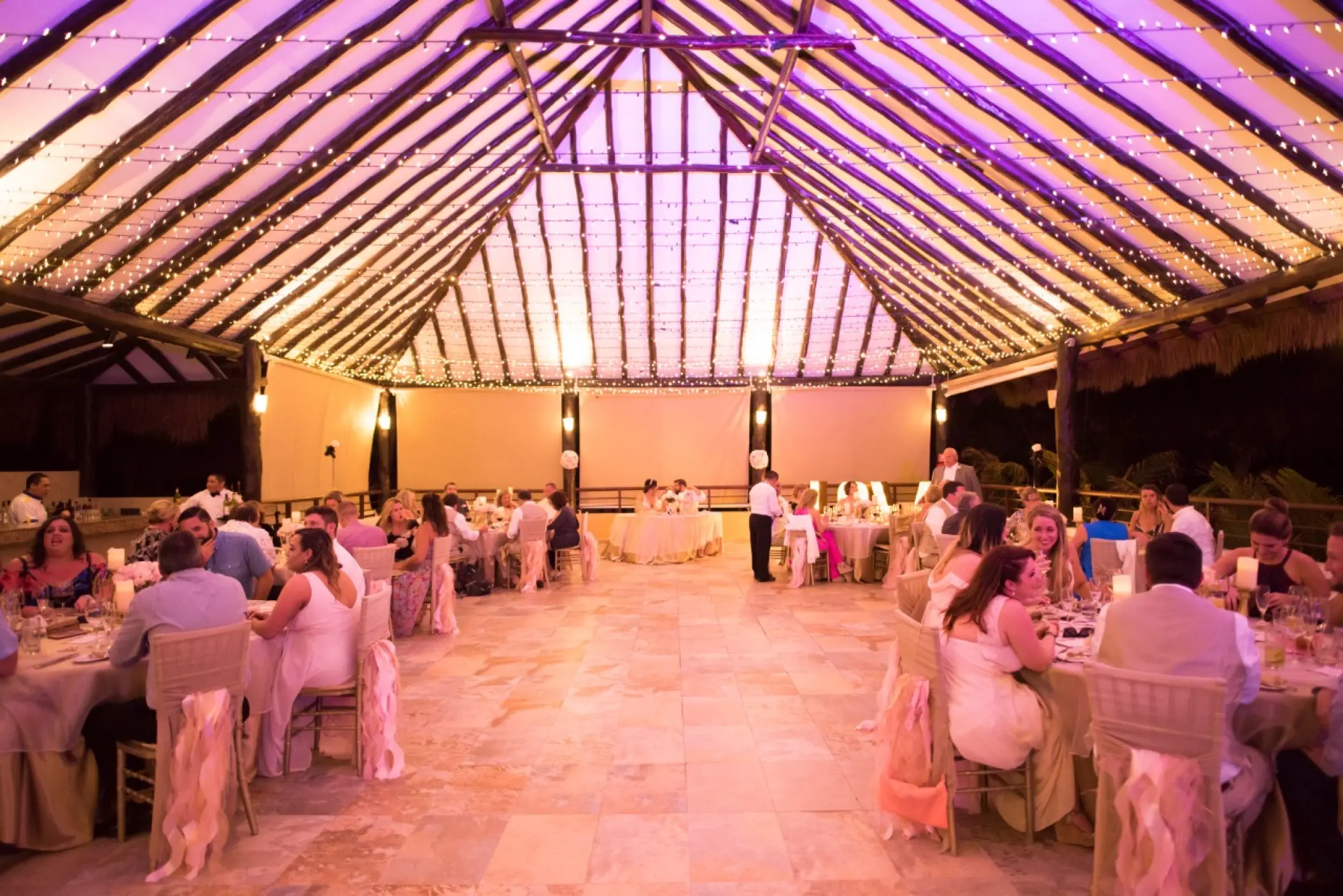Palapa wedding reception with string lights at El Dorado Seaside Palms, Riviera Maya