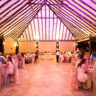 Palapa wedding reception with string lights at El Dorado Seaside Palms, Riviera Maya