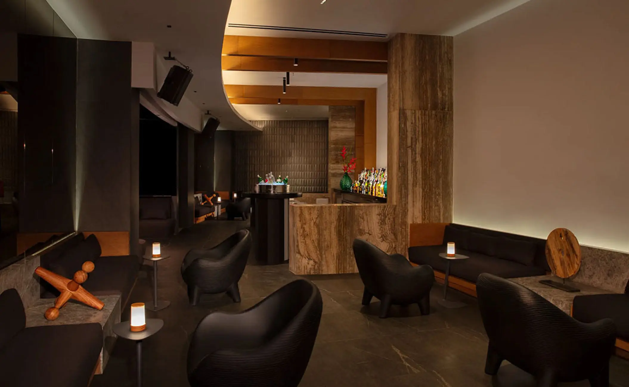 Secrets Bahia Mita speakeasy bar with modern seating and stone accents, Puerto Vallarta