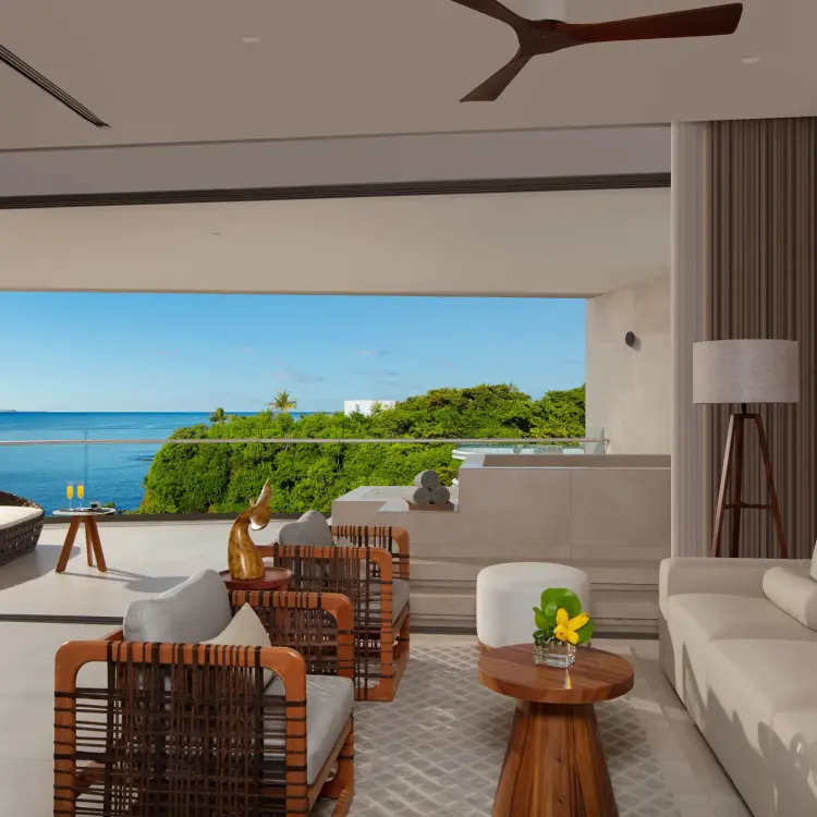 Living area and balcony with ocean views at Secrets Bahia Mita, Puerto Vallarta