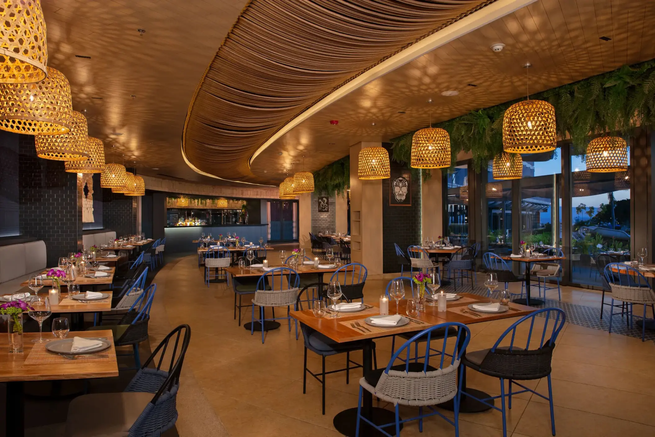 Secrets Bahia Mita restaurant dining room with woven pendant lights, Puerto Vallarta