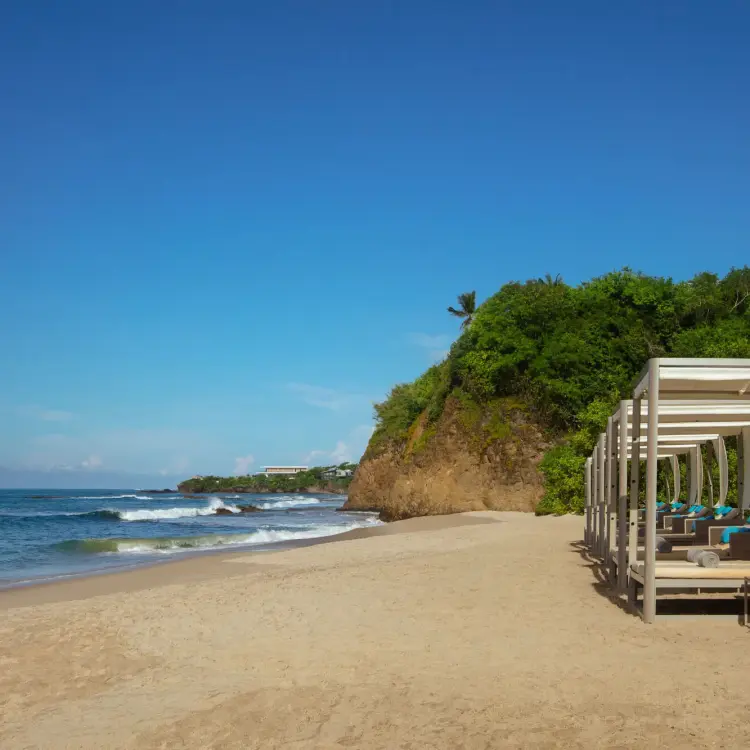Beachfront cabanas on the sand at Secrets Bahia Mita, Puerto Vallarta