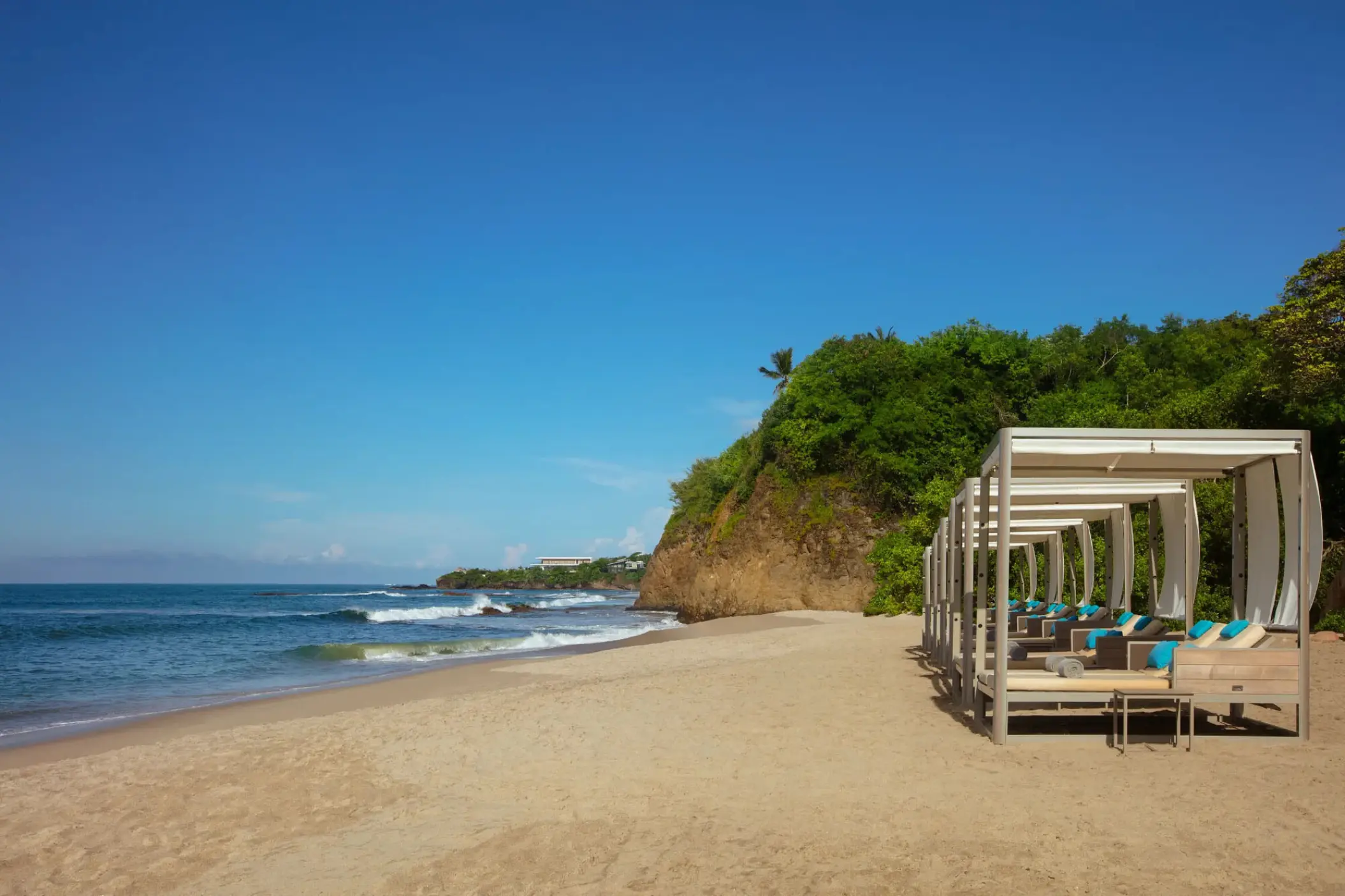 Beachfront cabanas on the sand at Secrets Bahia Mita, Puerto Vallarta