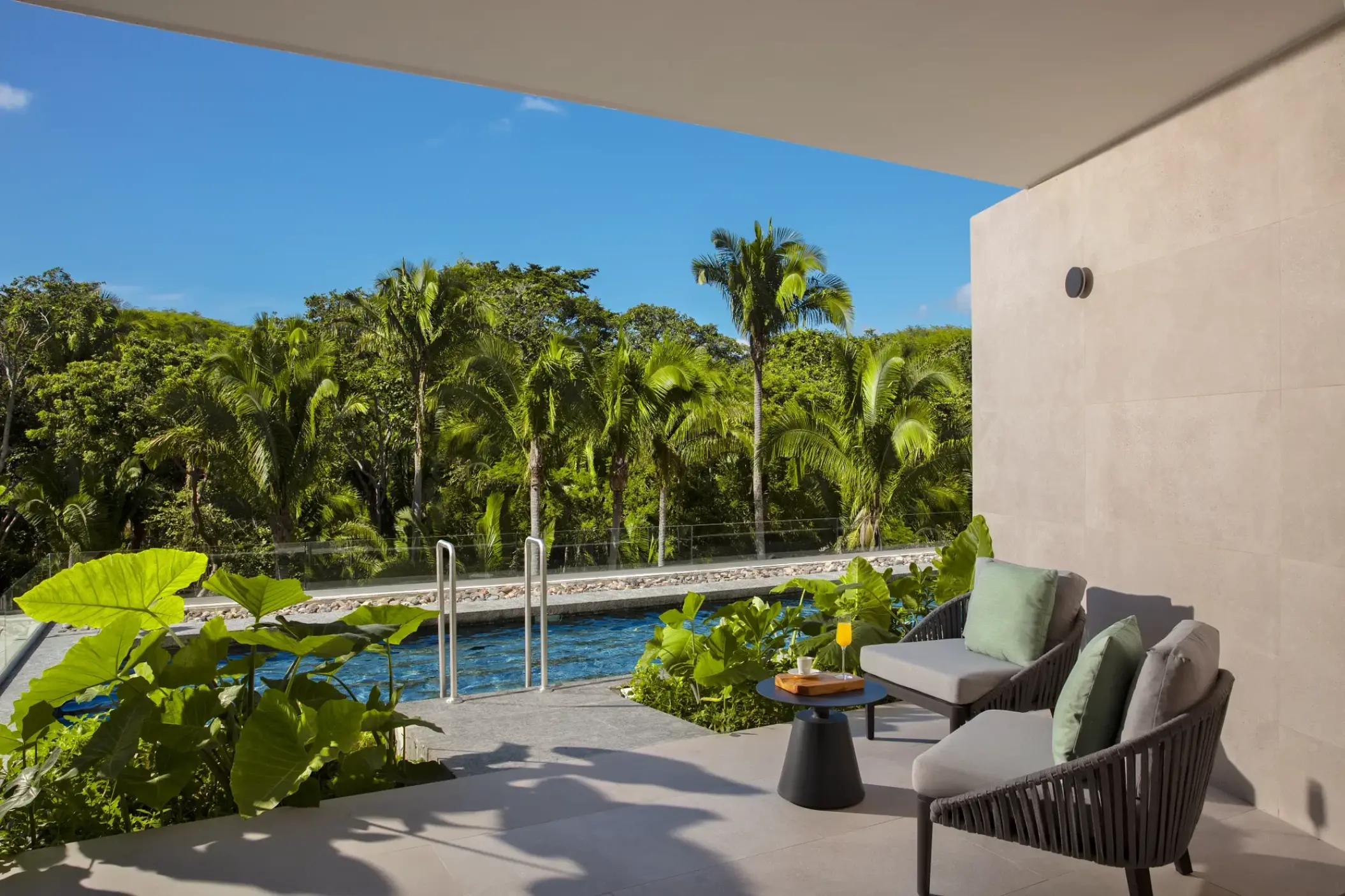 Dreams Bahia Mita suite balcony with outdoor seating and a swim-up pool, Puerto Vallarta