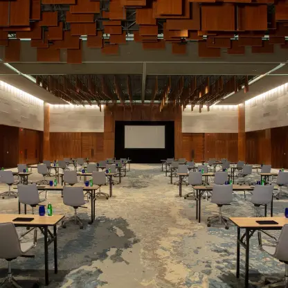 Modern ballroom with classroom seating and wooden ceiling panels at Dreams Bahia Mita, Puerto Vallarta