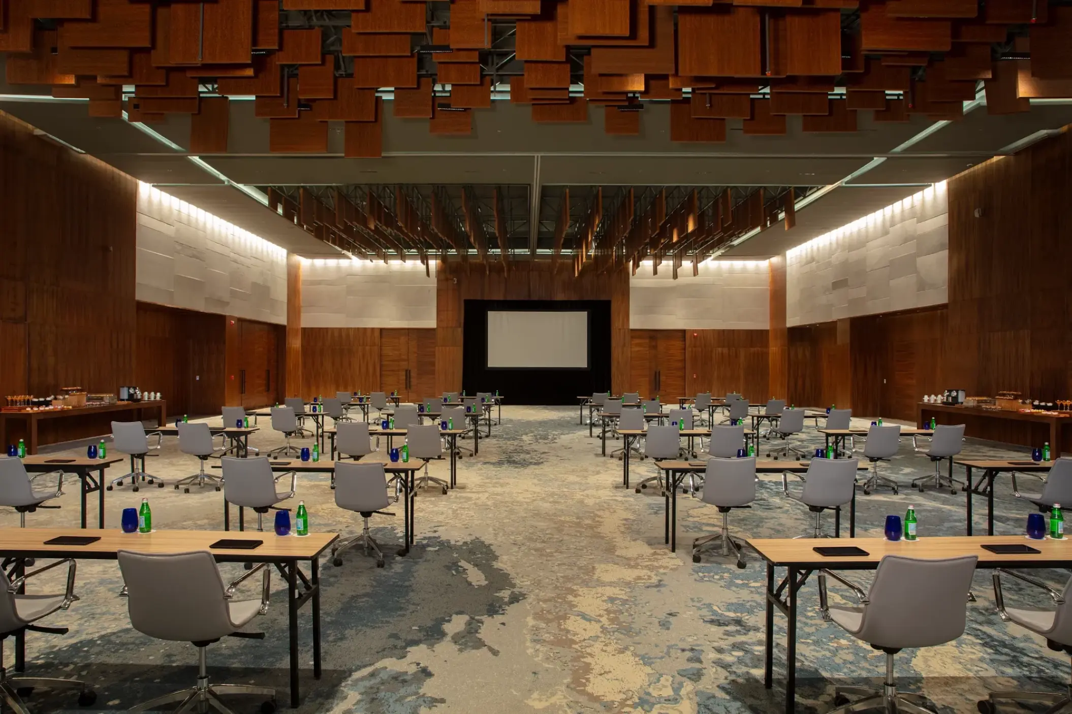 Modern ballroom with classroom seating and wooden ceiling panels at Dreams Bahia Mita, Puerto Vallarta