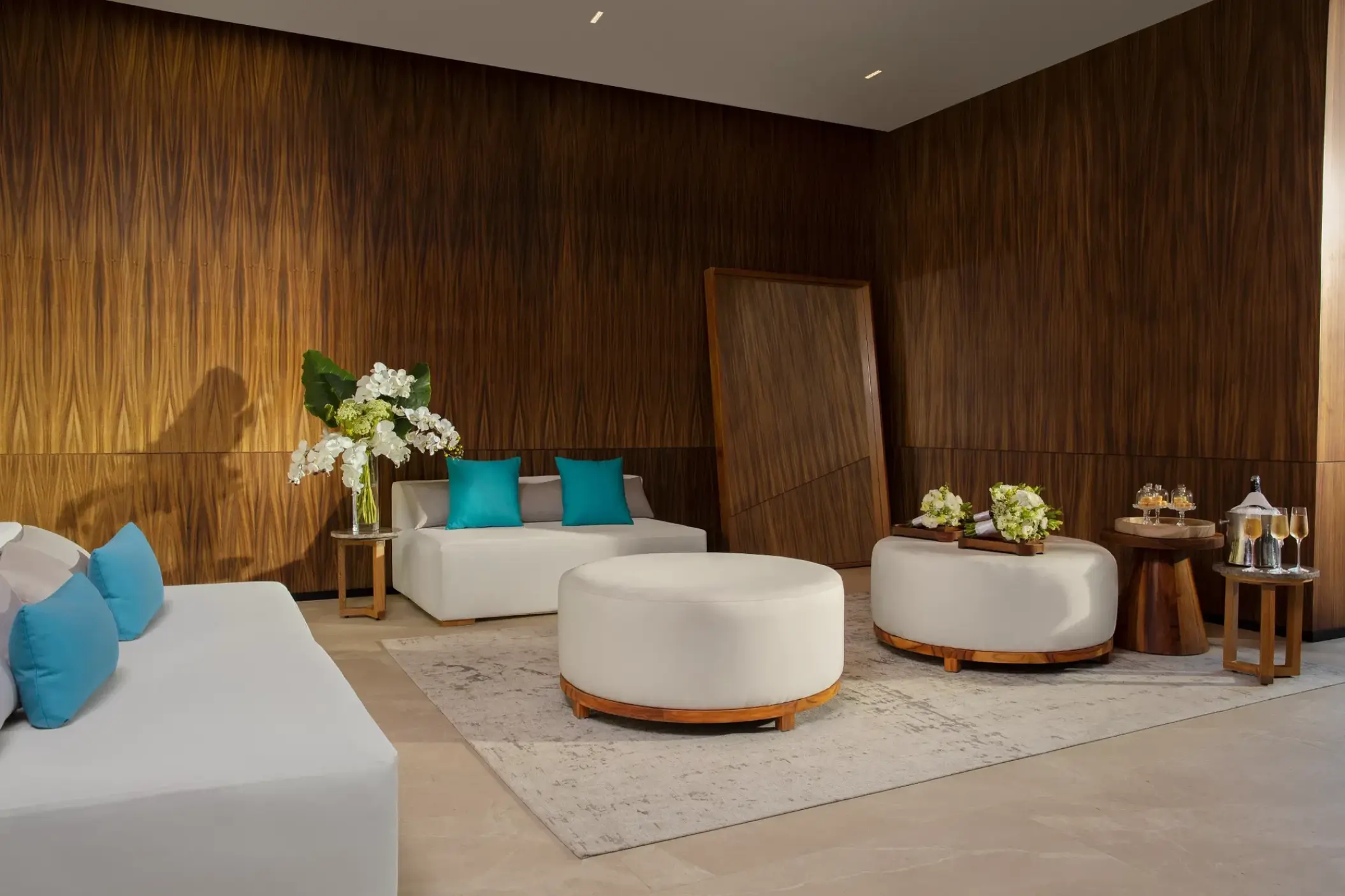 Dreams Bahia Mita bridal suite with wood-paneled walls and white seating, Puerto Vallarta