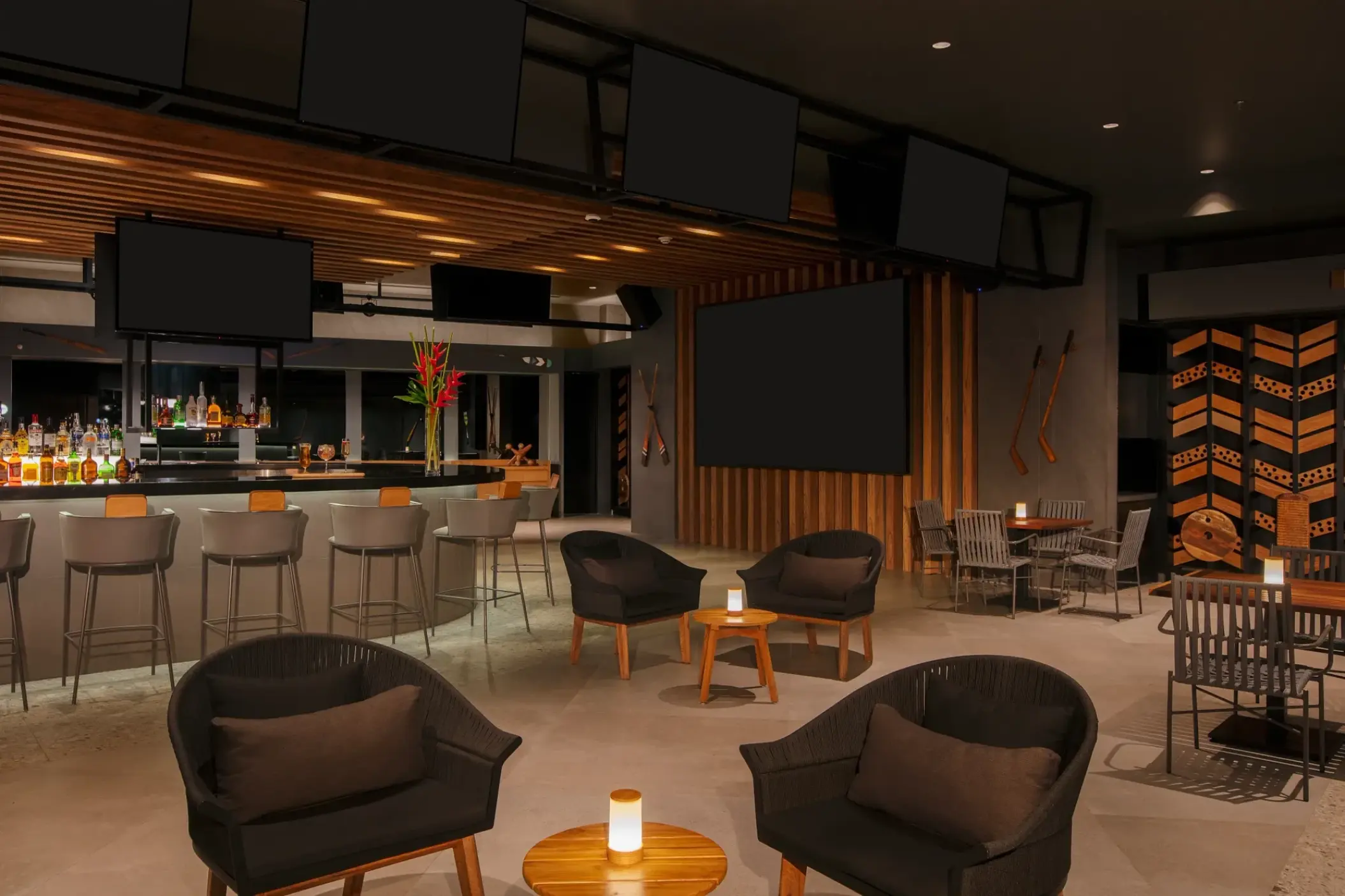 Desires Bar lounge area with modern seating and sports screens at Dreams Bahia Mita, Puerto Vallarta