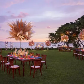 Garden wedding reception at Dreams Bahia Mita with pampas grass centerpieces and ocean views, Puerto Vallarta