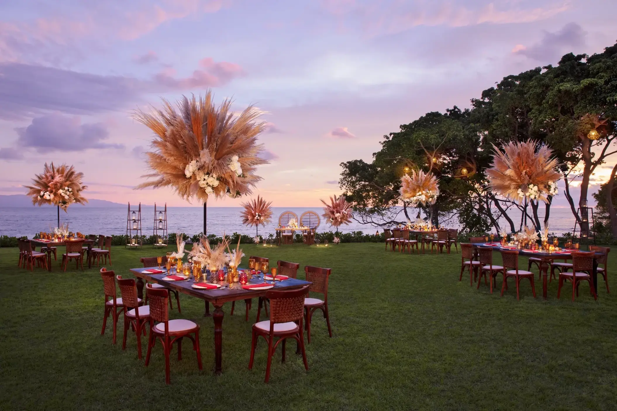 Garden wedding reception at Dreams Bahia Mita with pampas grass centerpieces and ocean views, Puerto Vallarta