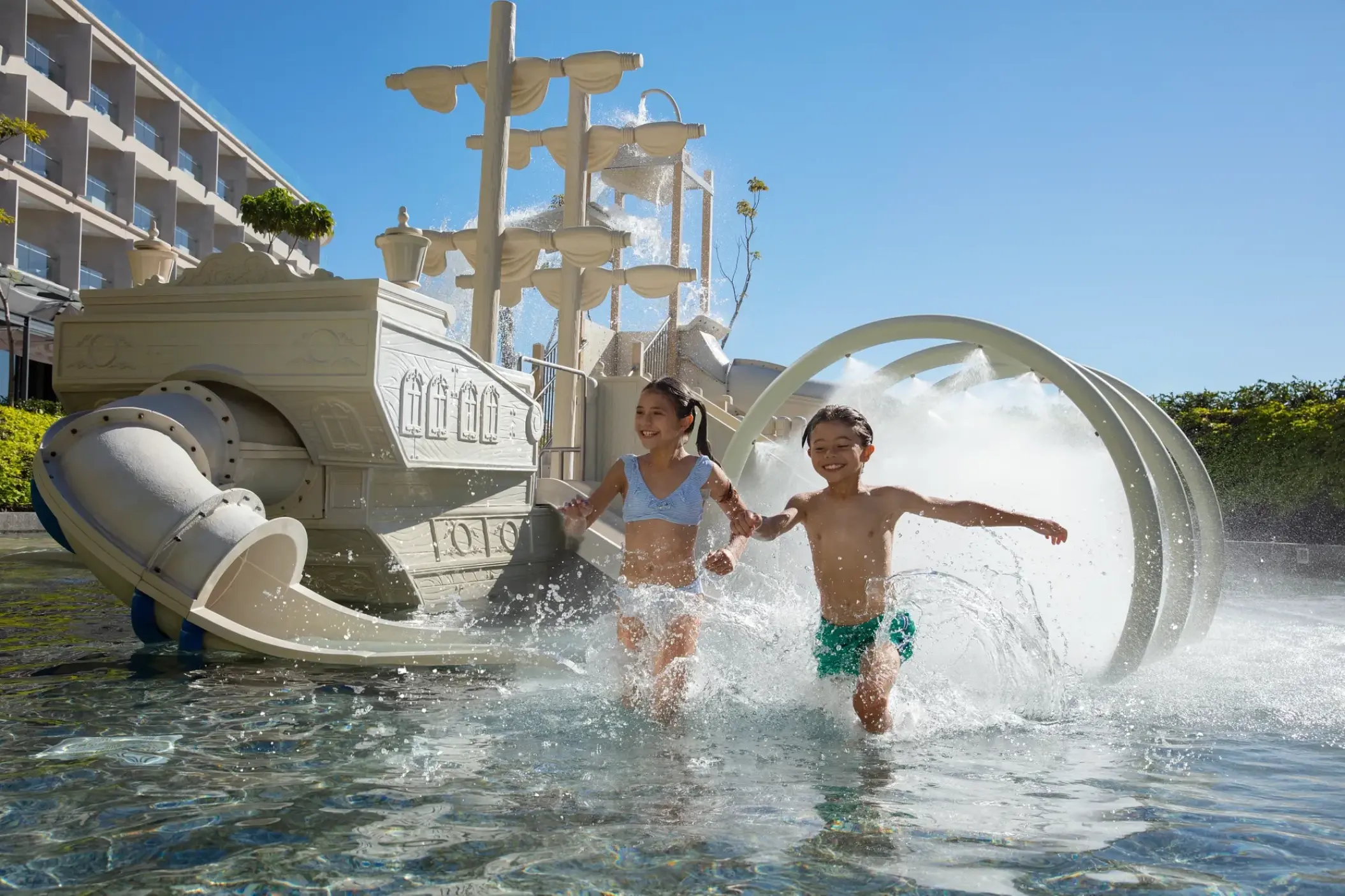 Children splashing in the kids pool pirate ship water feature at Dreams Bahia Mita, Puerto Vallarta