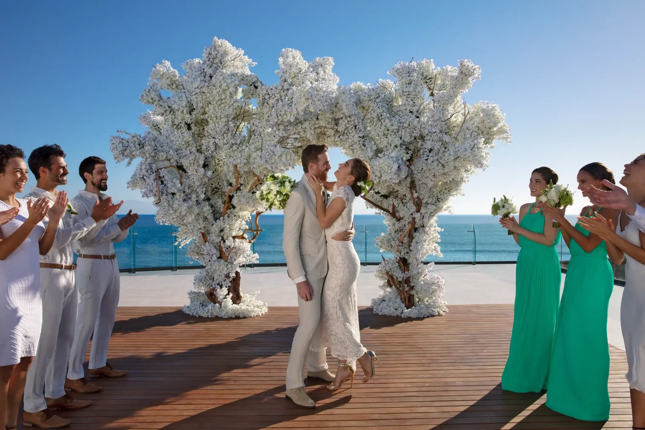 The couple celebrating a terrace wedding ceremony at Dreams Bahia Mita, Puerto Vallarta