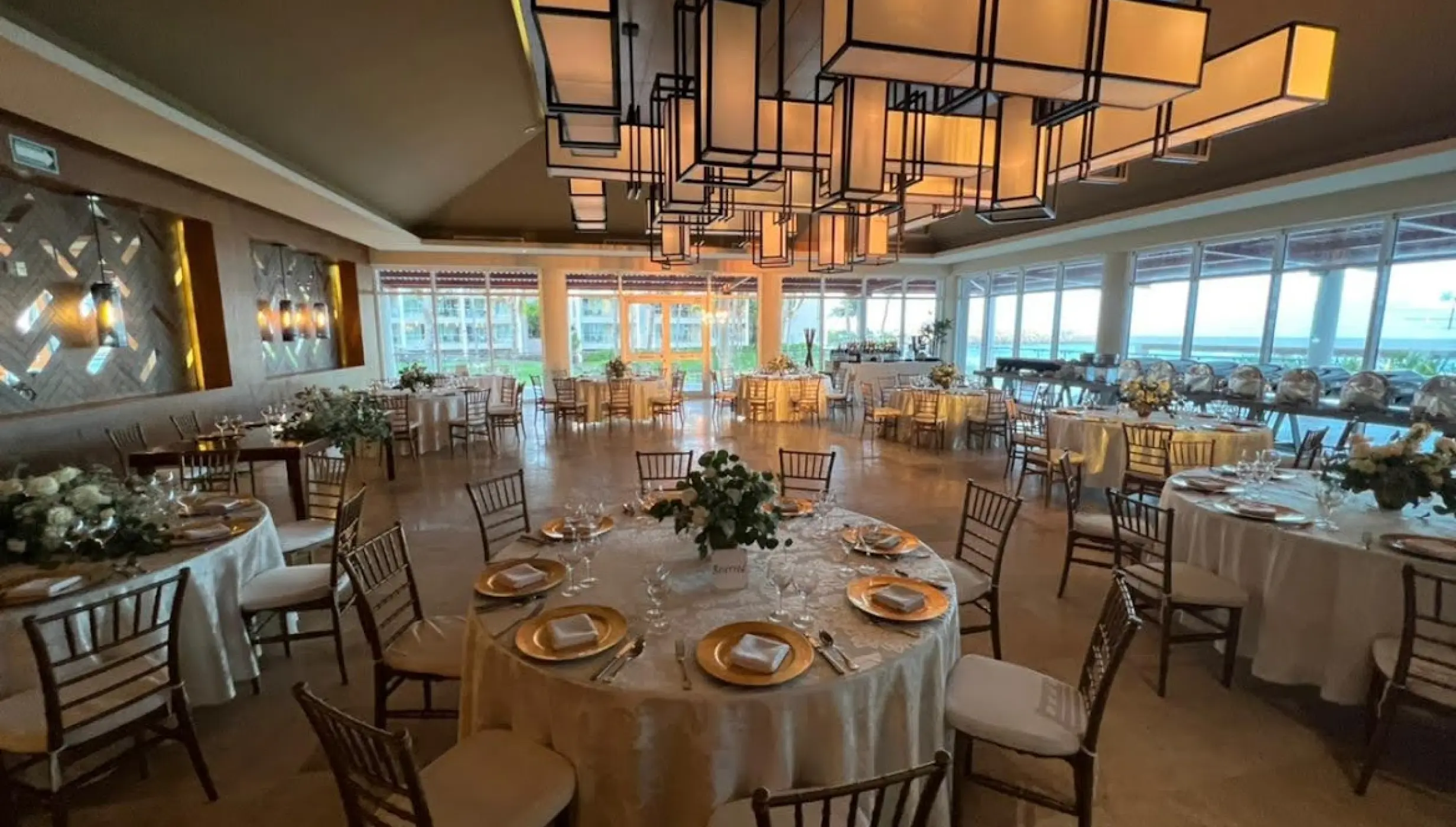Indoor wedding reception with modern lanterns at Dreams Jade, Riviera Maya