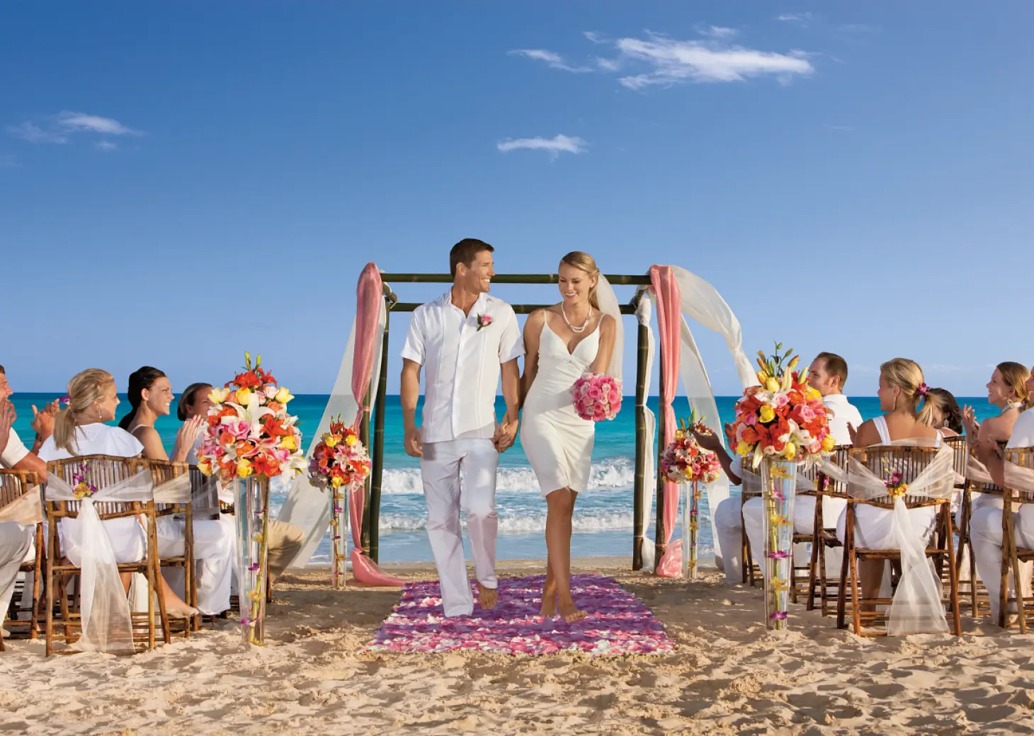 Bride and groom walking down the aisle at a beach ceremony, Dreams Jade, Riviera Maya