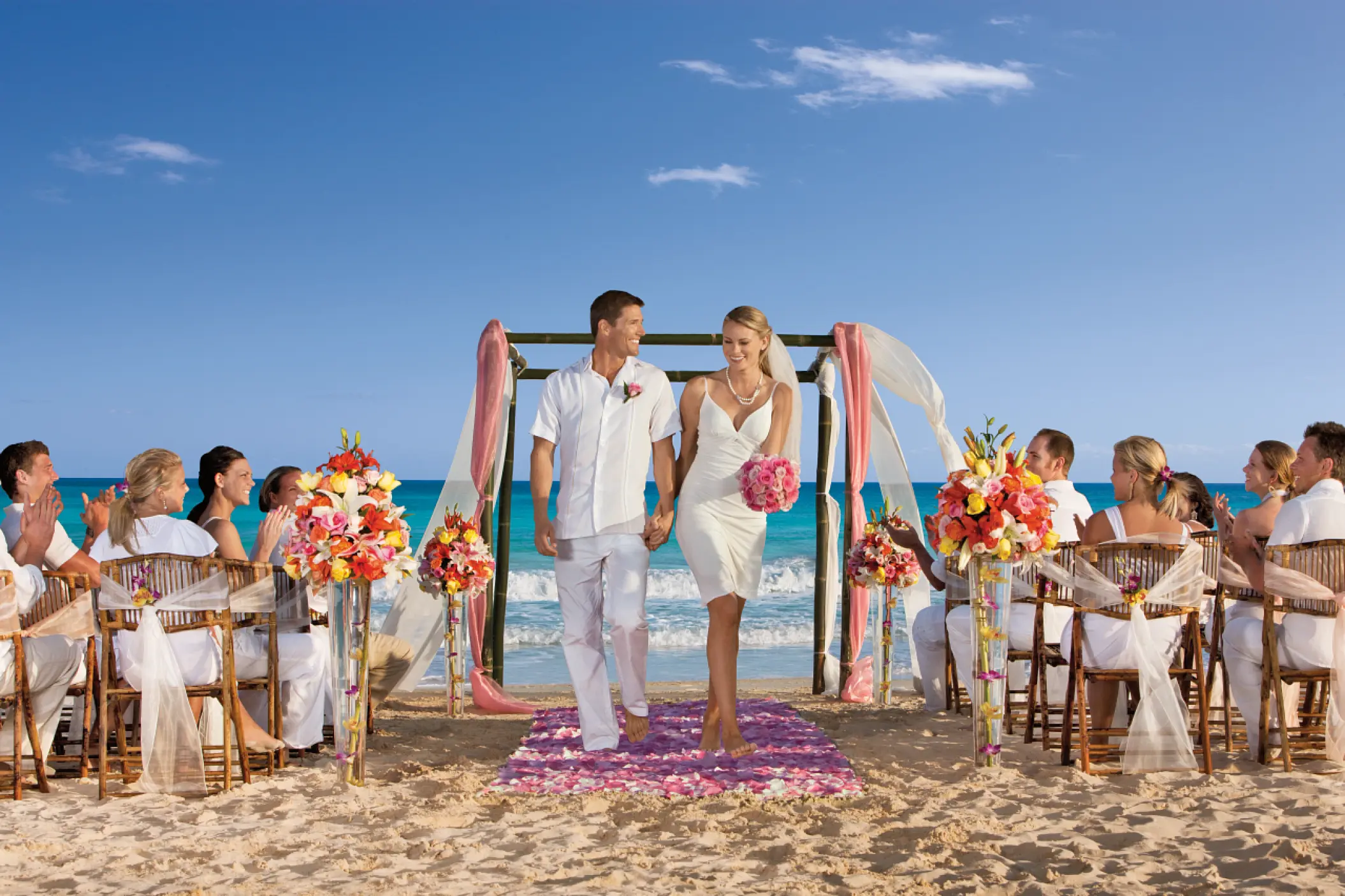 Bride and groom walking down the aisle at a beach ceremony, Dreams Jade, Riviera Maya