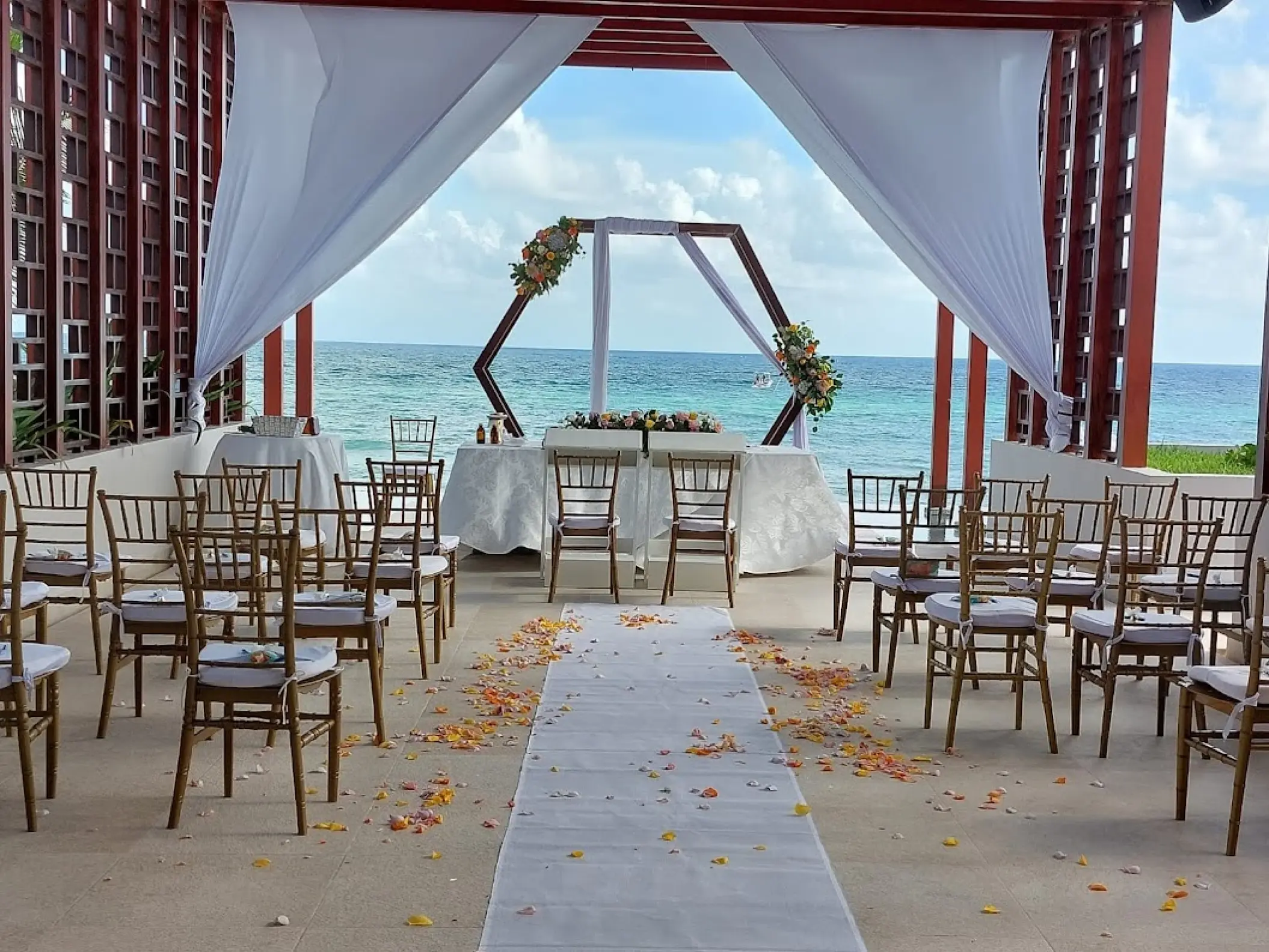 Pergola deck wedding ceremony with ocean views at Dreams Jade, Riviera Maya