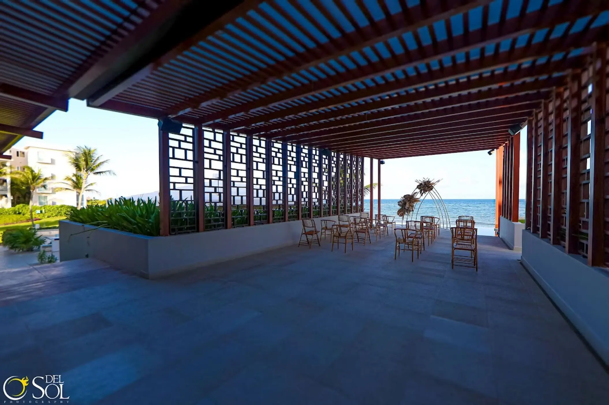 Pergola deck wedding ceremony with ocean views at Dreams Jade, Riviera Maya