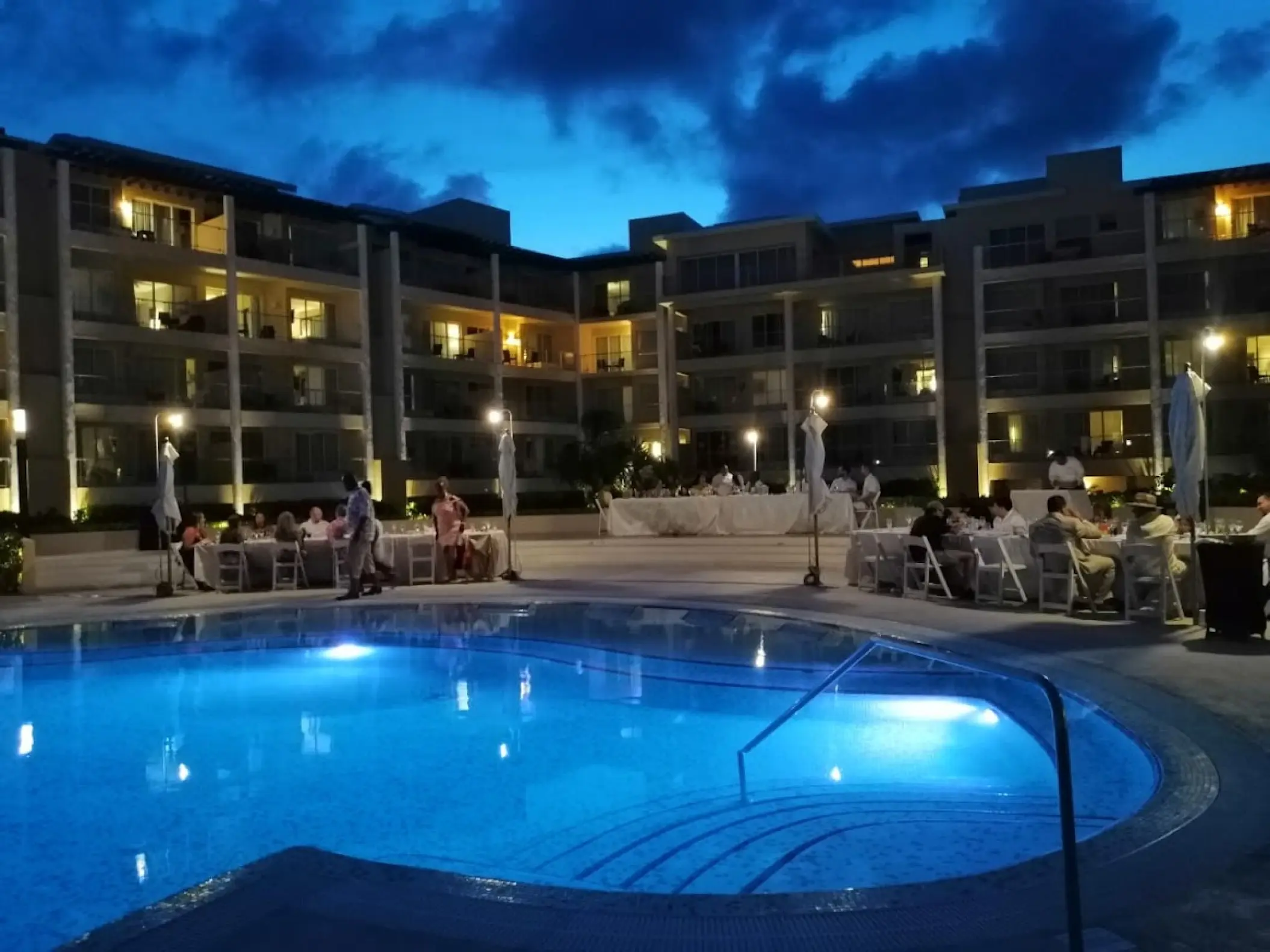 Evening wedding reception on the pool terrace at Dreams Jade, Riviera Maya