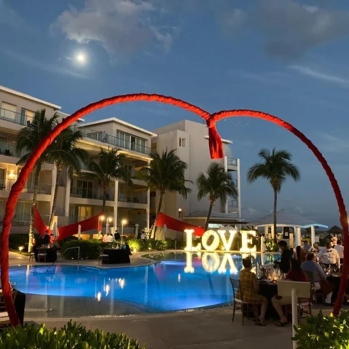 Ceremony decor on the pool terrace at dreams jade resort and spa