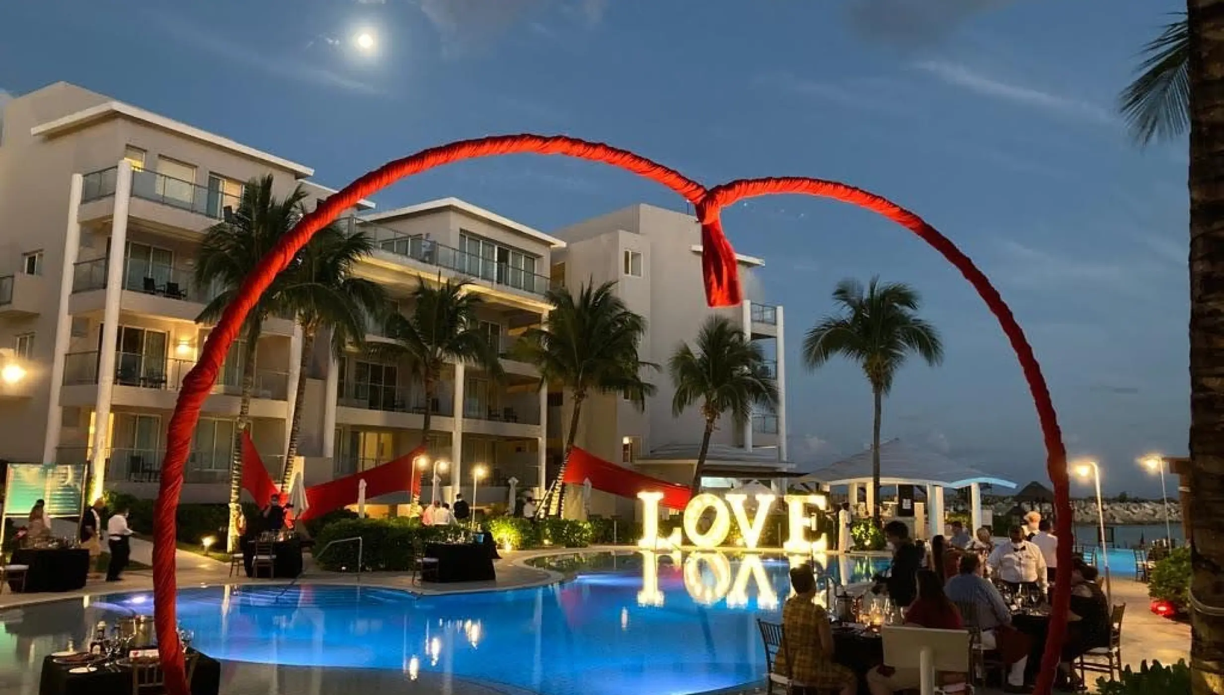 Ceremony decor on the pool terrace at dreams jade resort and spa
