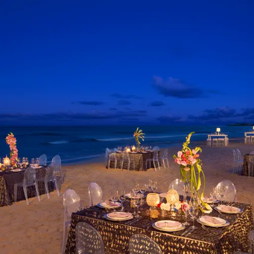 Beach wedding reception with candlelit tables at Dreams Jade, Riviera Maya