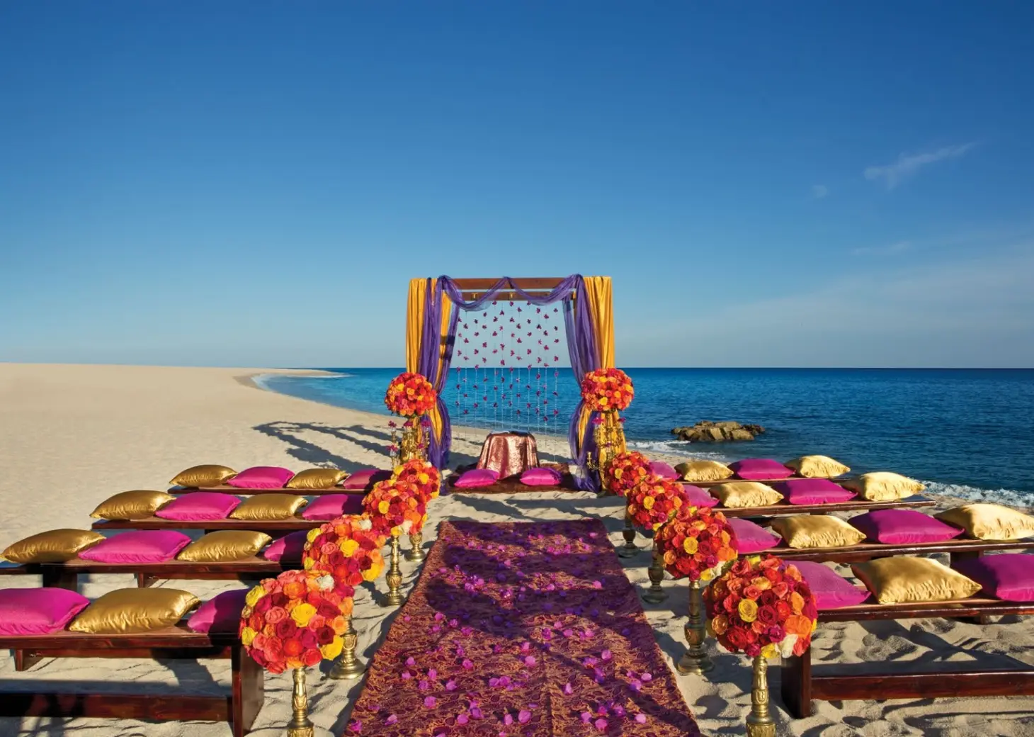 Ceremony decor on the beach at Dreams Los Cabos Suites Golf Resort & Spa