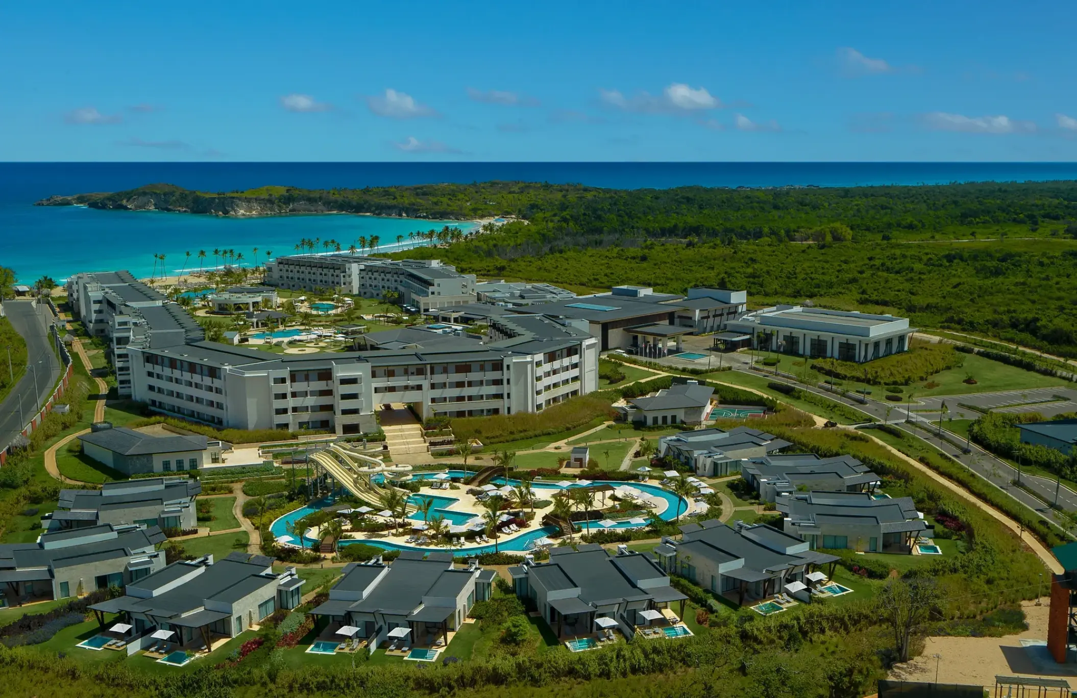 Aerial view of Dreams Macao Beach grounds, waterpark, and coastline, Punta Cana