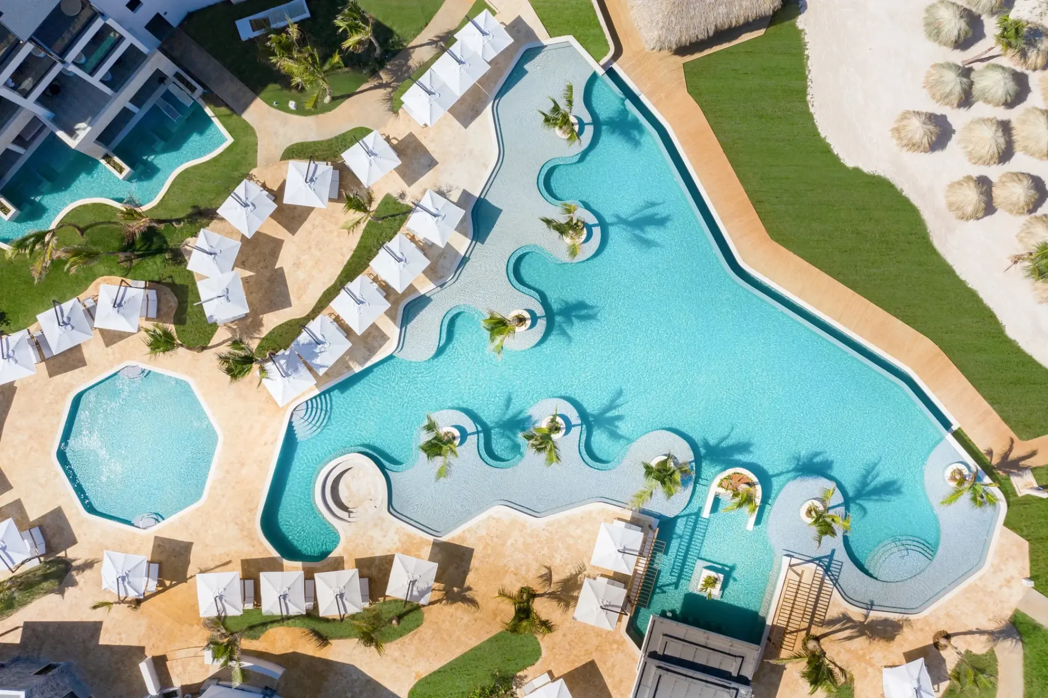 Aerial view of the infinity pool and lounge area at Dreams Macao Beach, Punta Cana