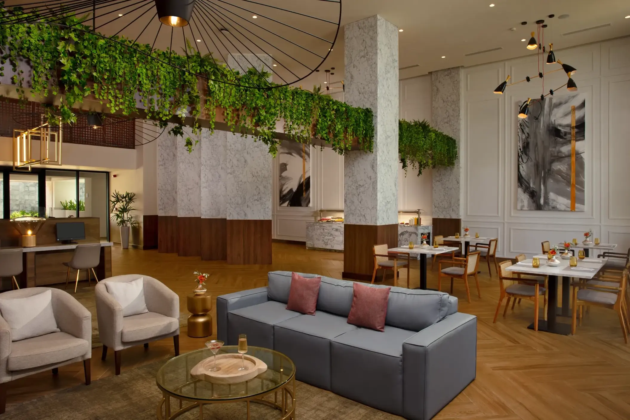 Preferred Club lounge with modern seating and hanging plants at Dreams Macao Beach, Punta Cana