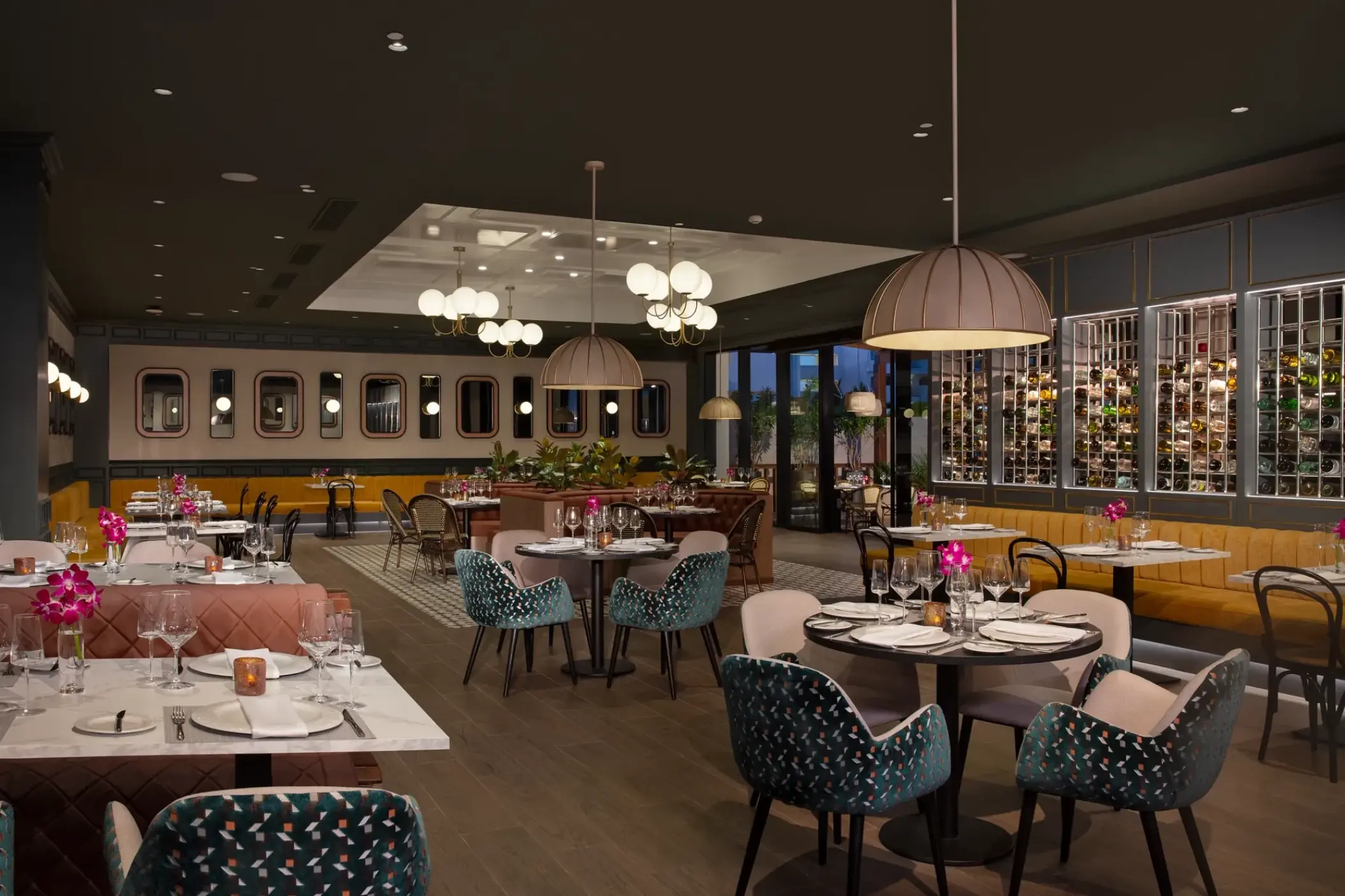 Bordeaux restaurant with modern seating and round tables at Dreams Macao Beach, Punta Cana