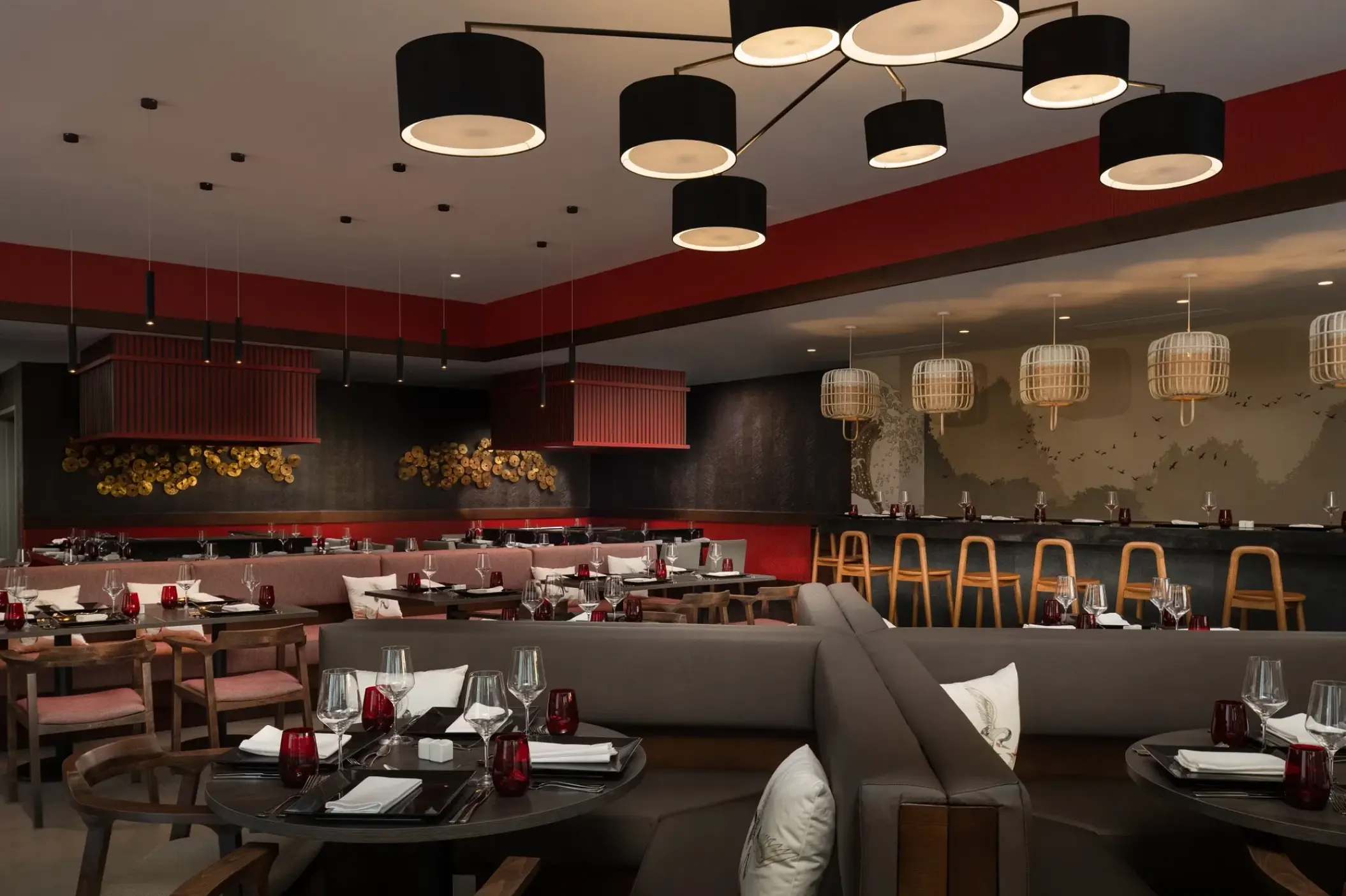 Himitsu restaurant interior with dark wooden tables and modern lighting at Dreams Macao Beach, Punta Cana