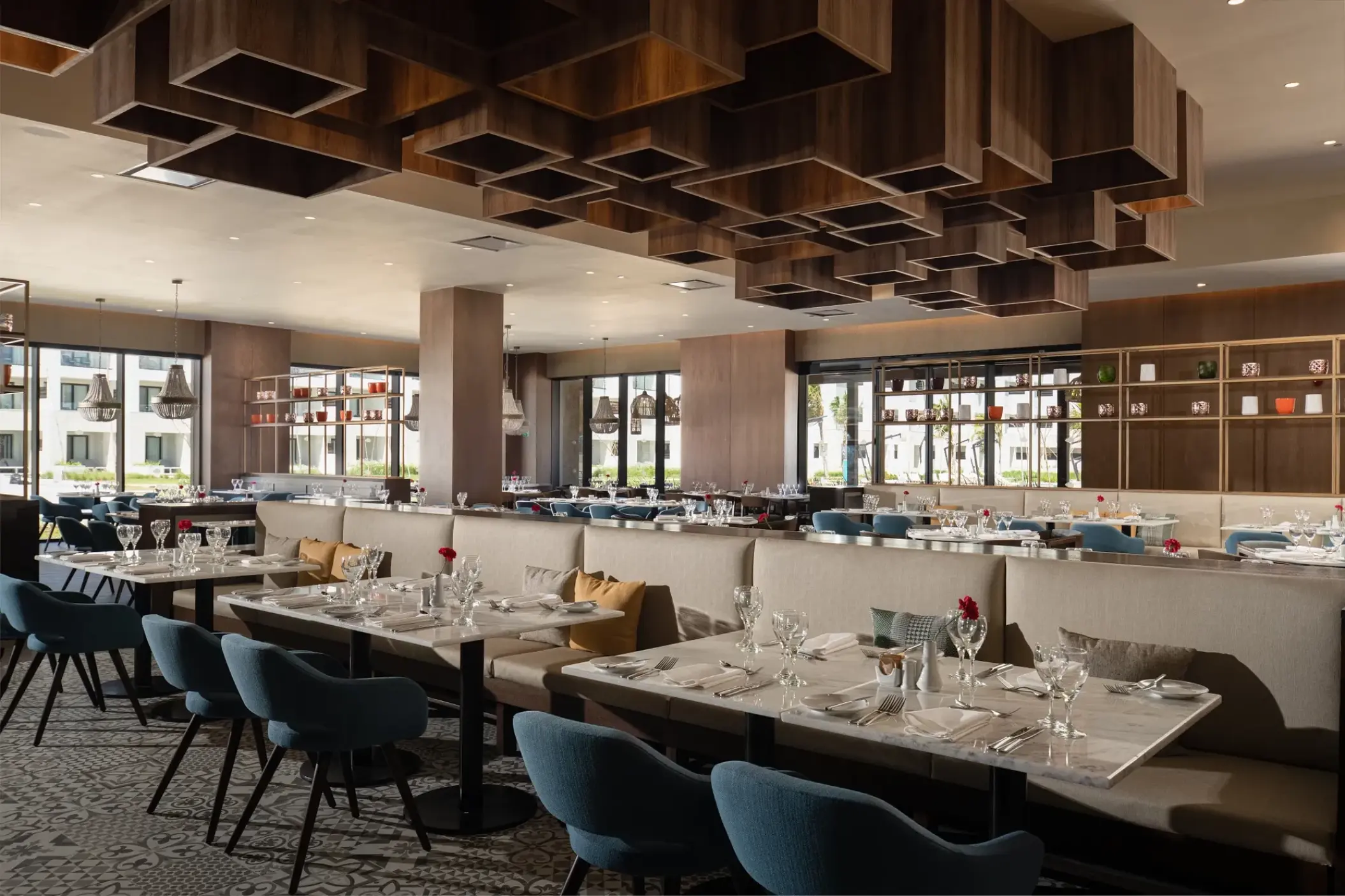 Modern World Cafe dining room with geometric ceiling features at Dreams Macao Beach, Punta Cana