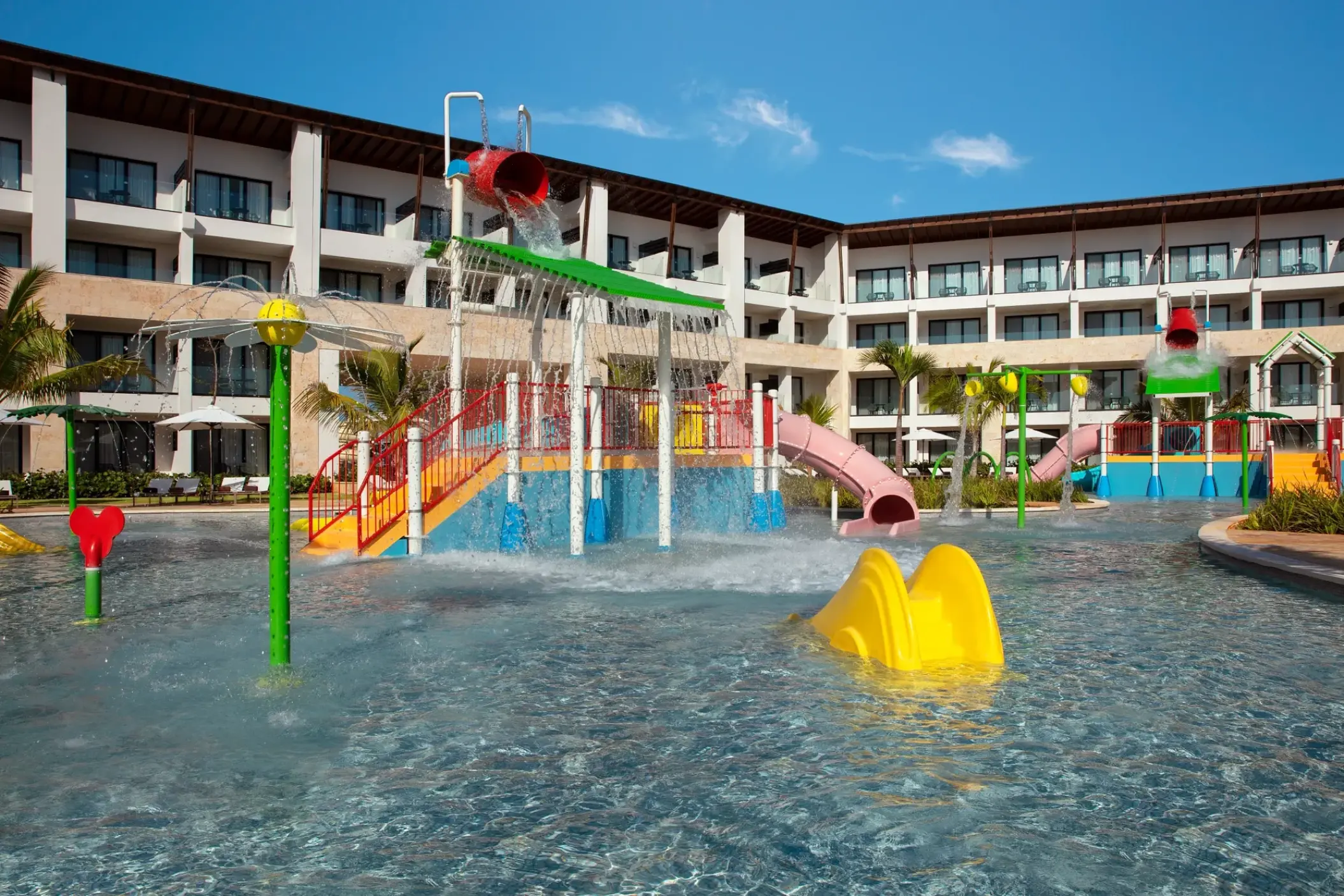 Colorful kids waterpark with slides and splash pads at Dreams Macao Beach, Punta Cana