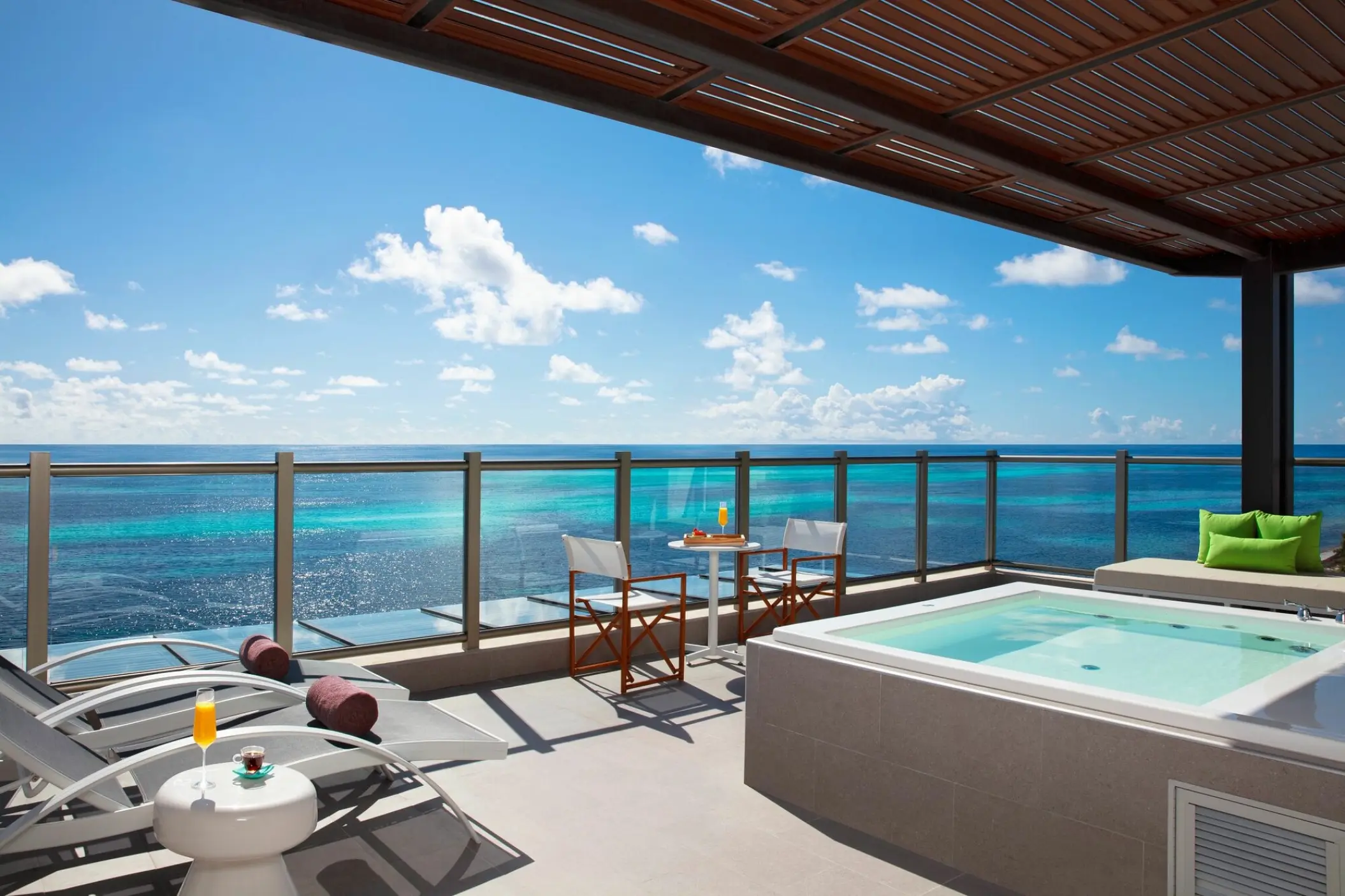 Oceanfront room terrace with private whirlpool and sun loungers at Dreams Natura, Riviera Maya