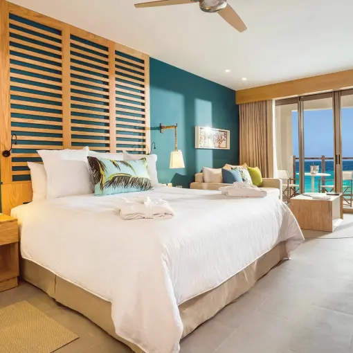 Ocean view suite with king bed and private balcony at Dreams Natura, Riviera Maya