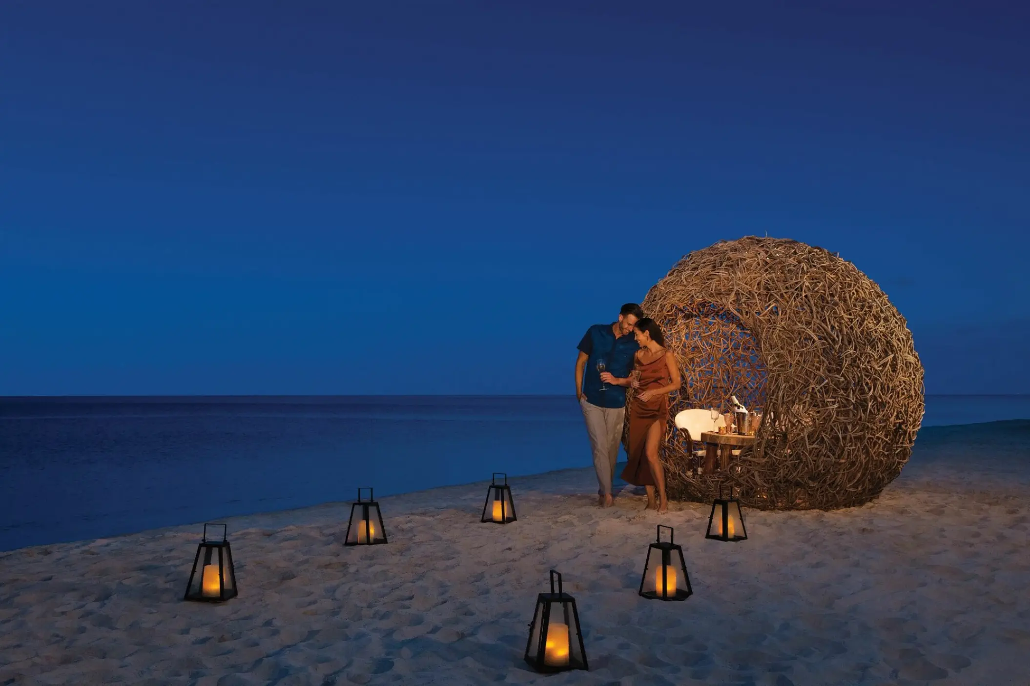 Romantic beach dinner with lanterns at Dreams Natura, Riviera Maya