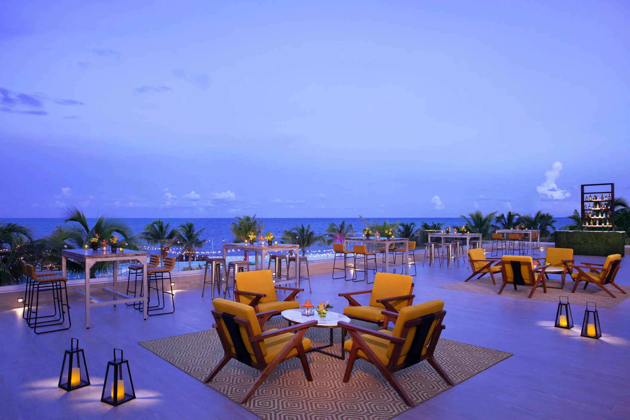 Rooftop wedding reception with bar at Dreams Natura Resort and Spa