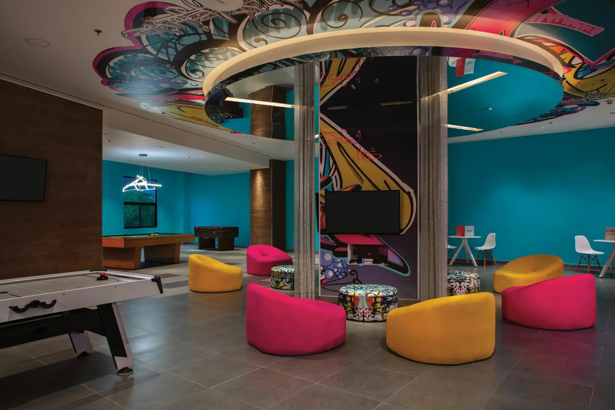 Colorful teens club with bean bags and games at Dreams Natura, Riviera Maya