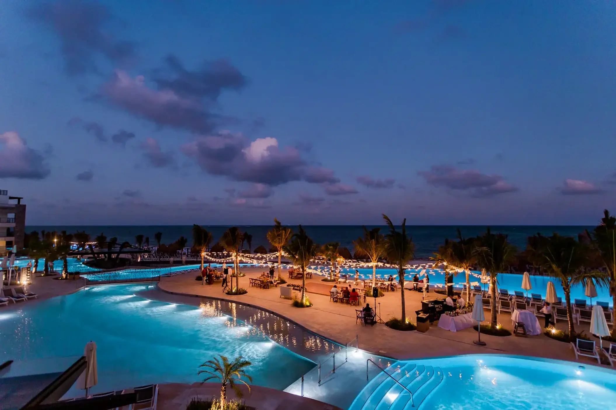 Evening wedding reception on the pool terrace at Dreams Natura