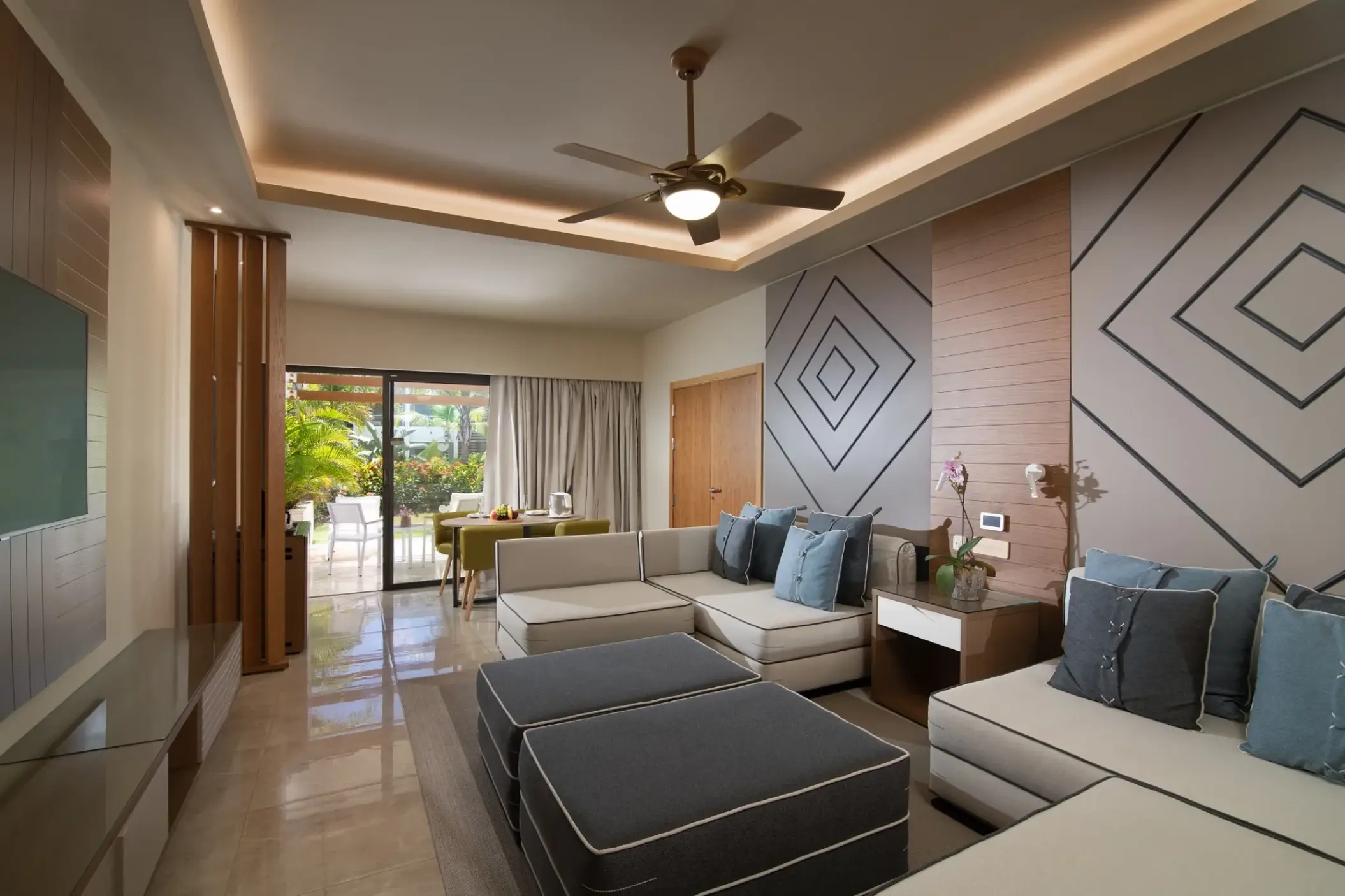 Two-bedroom family suite living area with sectional sofa at Dreams Onyx, Punta Cana