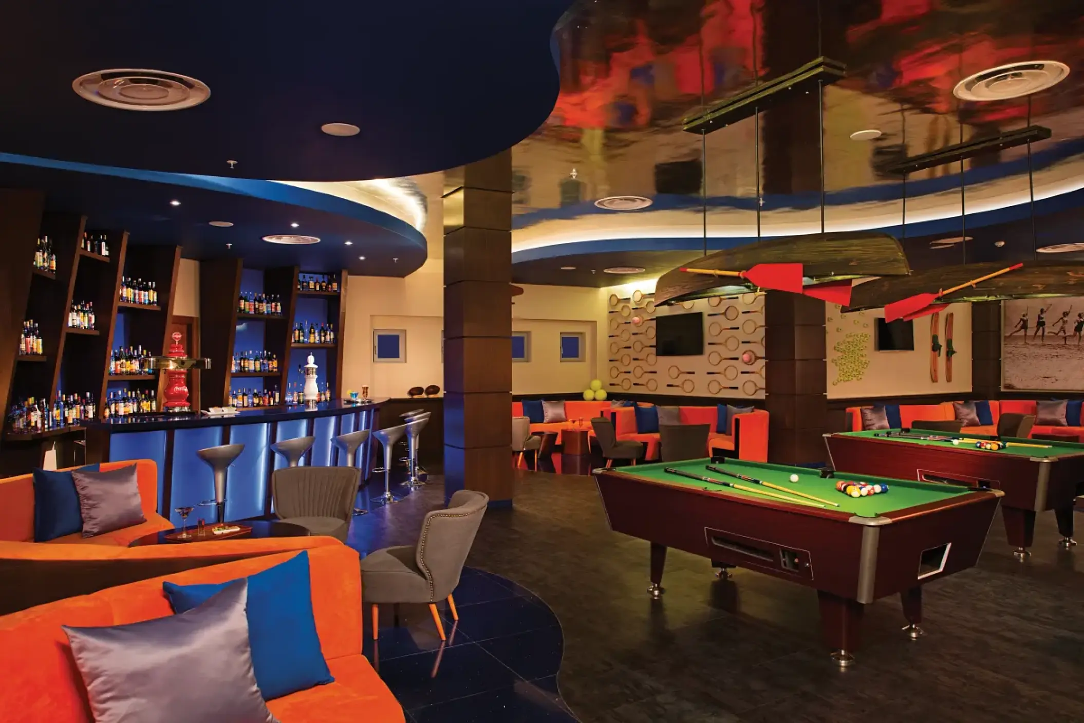 Scores sports bar with pool tables and blue lighting at Dreams Onyx, Punta Cana