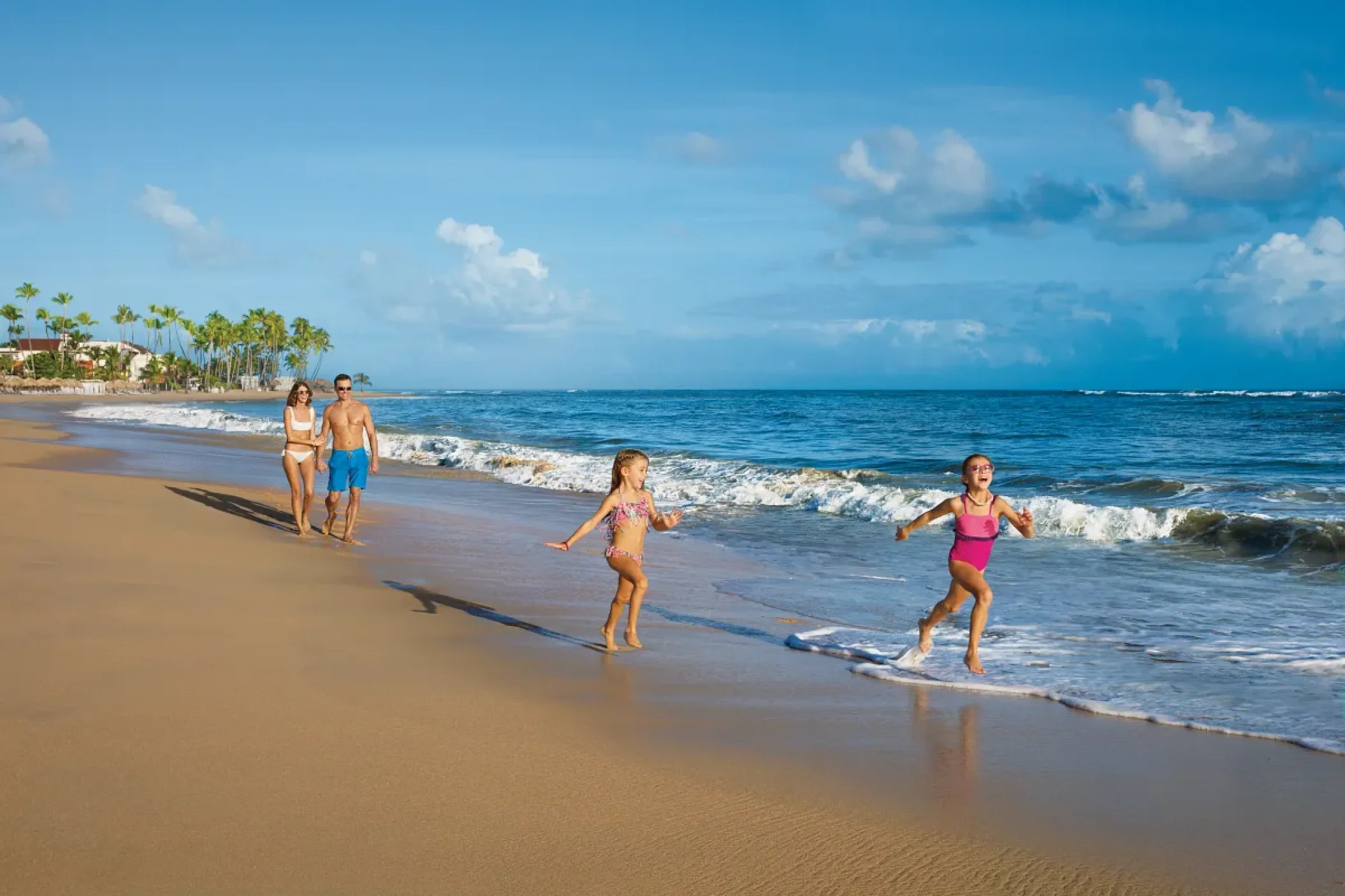 Family on the beach at Dreams Onyx Resort & Spa