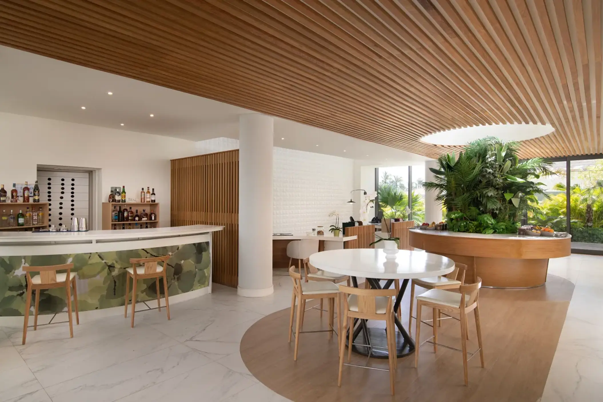 Family section lounge with a modern wood slat ceiling and bar at Dreams Onyx, Punta Cana