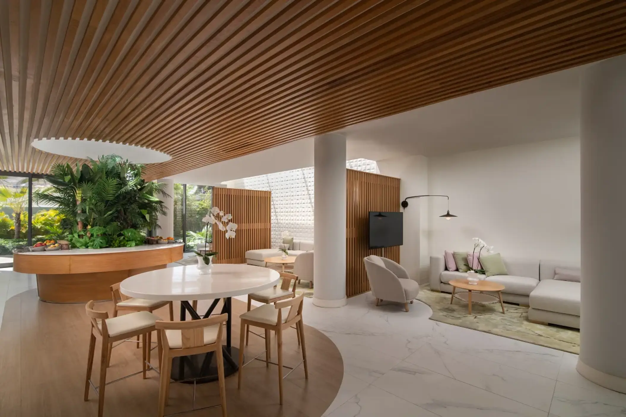 Family section lounge with modern seating and wood-slat ceiling at Dreams Onyx, Punta Cana