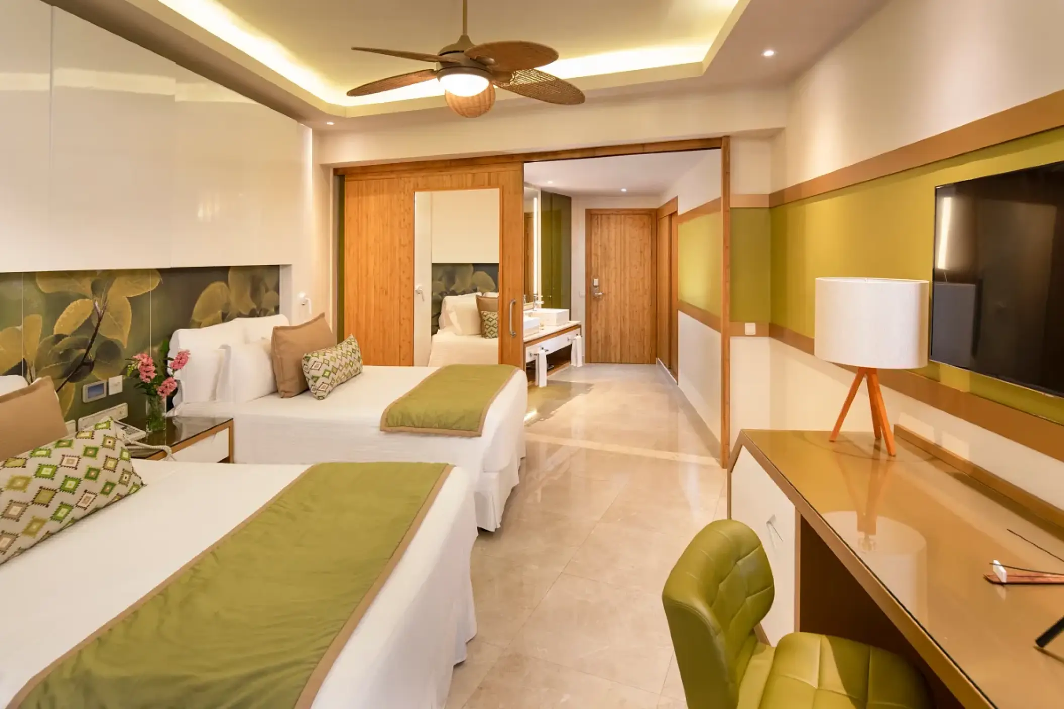 Dreams Onyx junior suite with two beds and green accents, Punta Cana