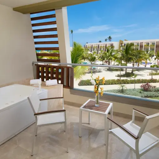 Junior suite terrace with a whirlpool tub overlooking the grounds at Dreams Onyx, Punta Cana
