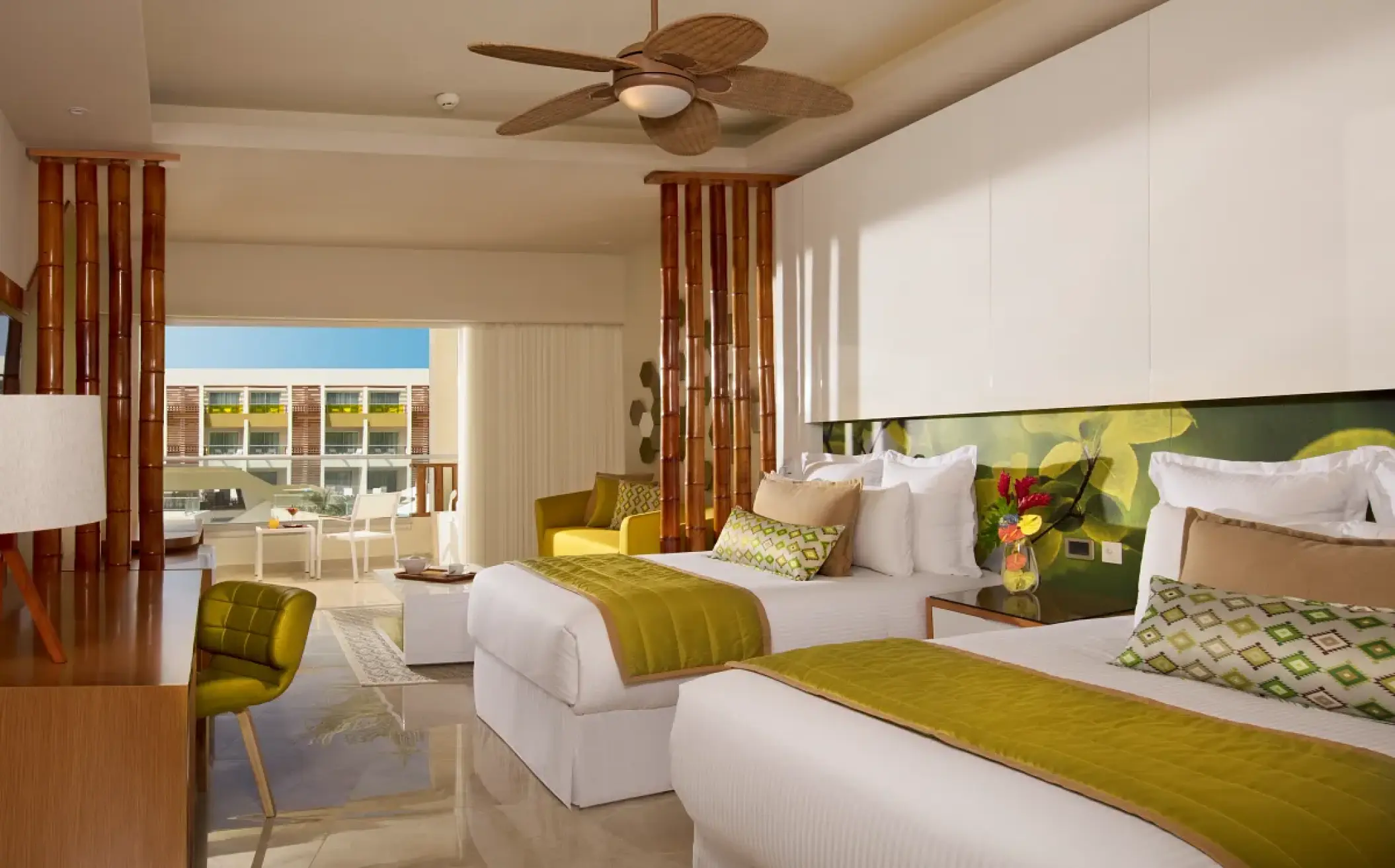 Junior suite with two beds and a private balcony at Dreams Onyx, Punta Cana
