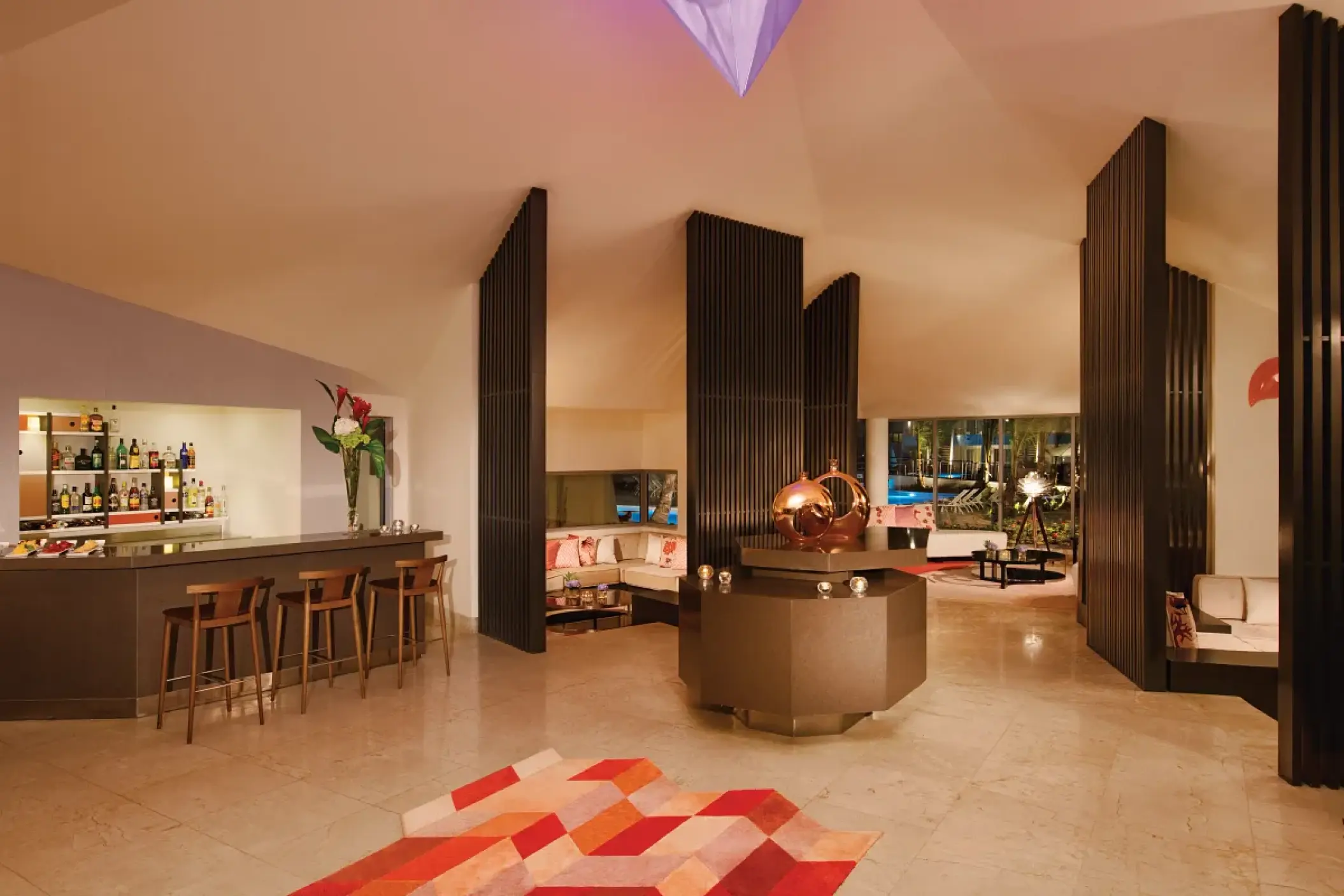 Modern indoor bar and lounge area at Dreams Onyx, Punta Cana