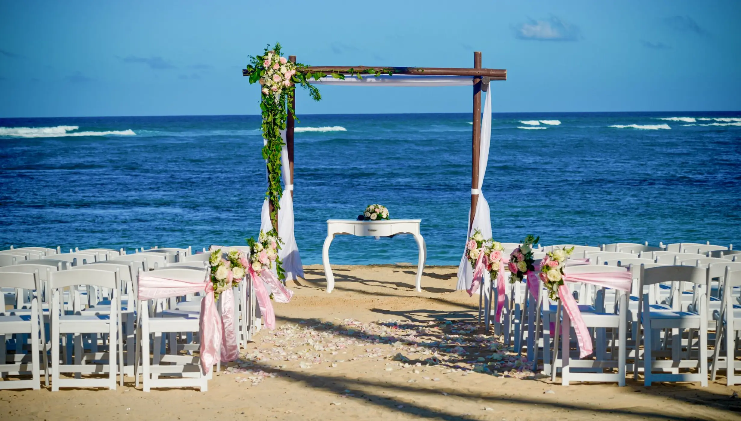 Ceremony decor on the stone beach at Dreams Onyx Resort & Spa