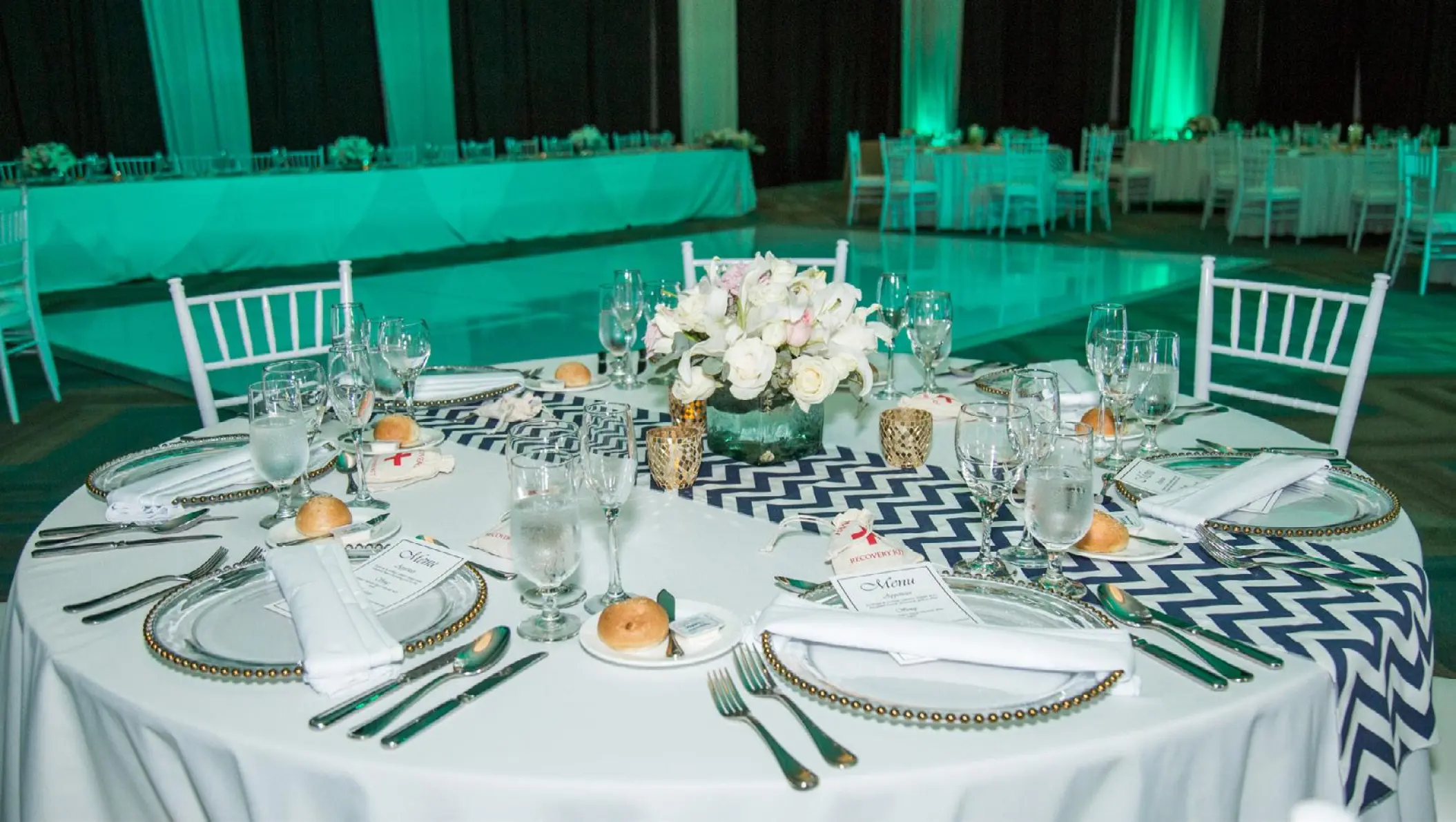 Ballroom wedding reception setup with chevron runner at Dreams Playa Mujeres, Cancun